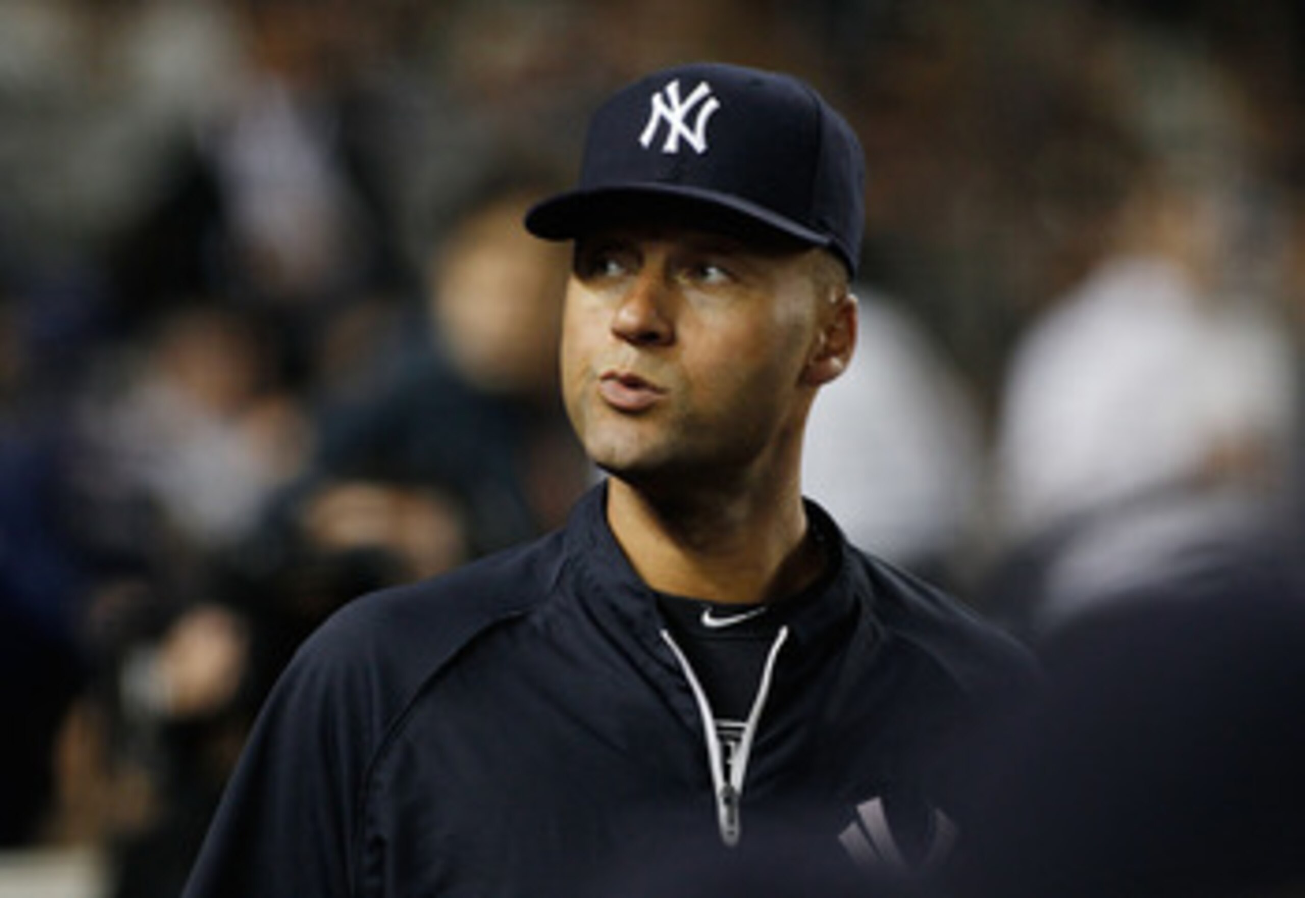 NEW YORK - JUNE 14:  Derek Jeter #2 of the New York Yankees looks on from the bench shortly after being placed on the 15 day disable list during the game against the Texas Rangers on June 14, 2011 at Yankee Stadium in the Bronx borough of New York City.
