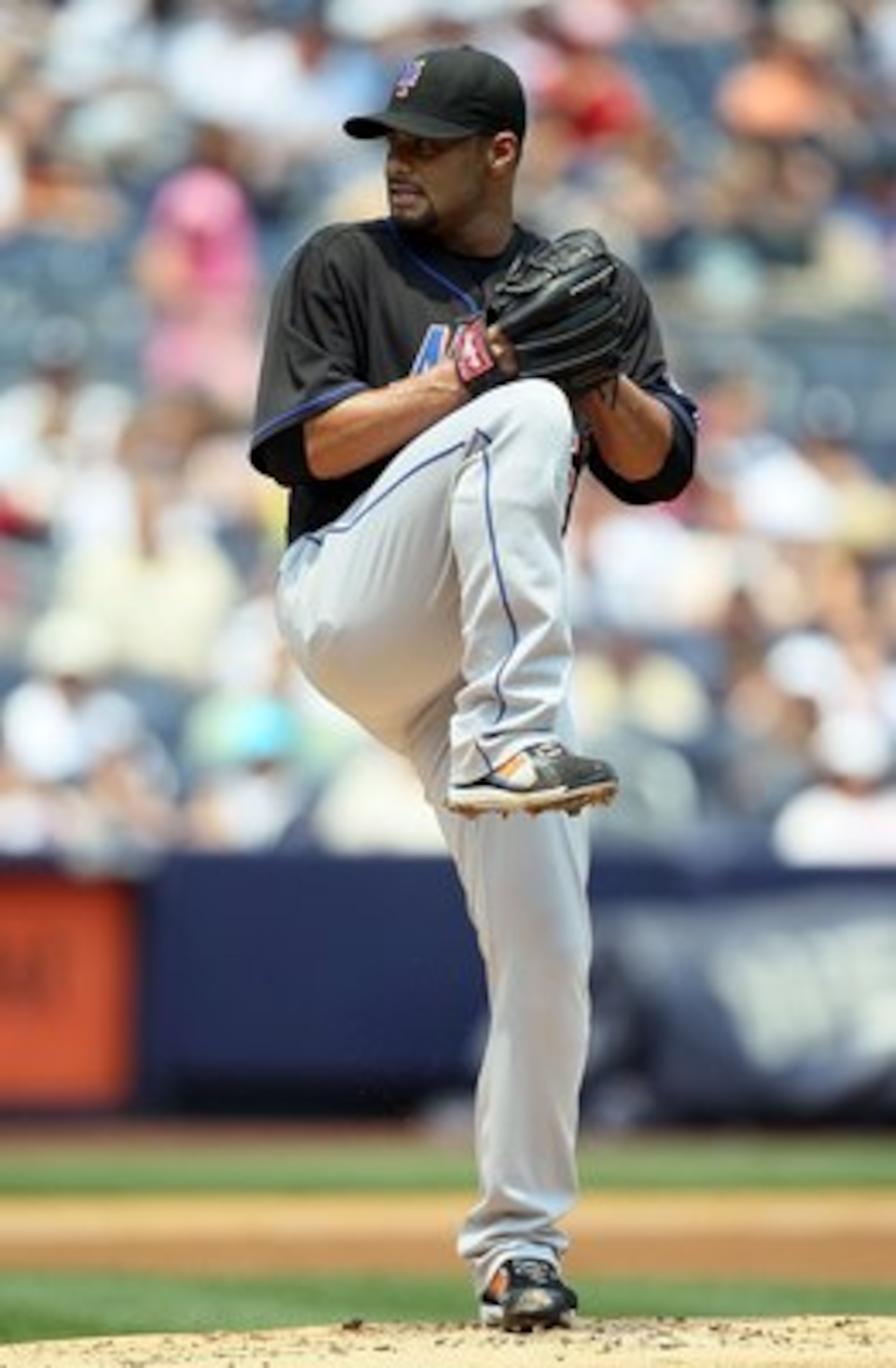 NEW YORK - JUNE 20:  Johan Santana #57 of the New York Mets delivers a pitch against the New York Yankees on June 20, 2010 at Yankee Stadium in the Bronx borough of New York City.  (Photo by Jim McIsaac/Getty Images)