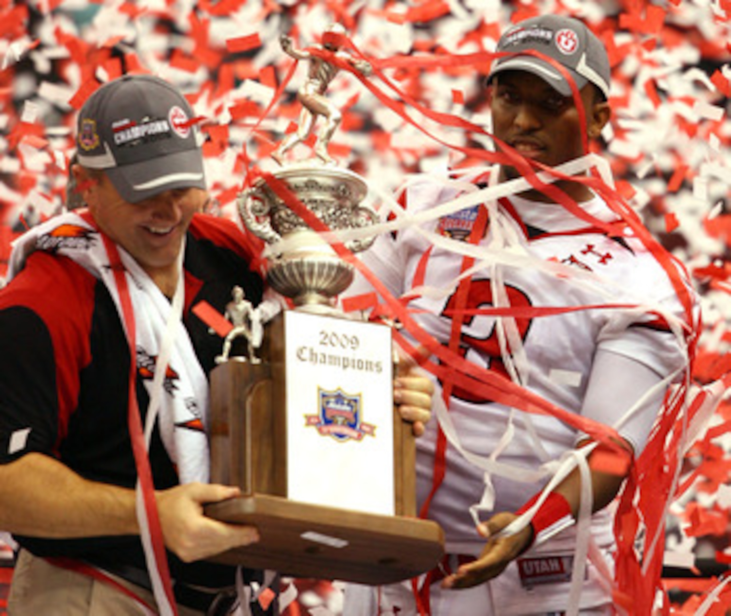 NEW ORLEANS - JANUARY 02:  Head coach Kyle Whittingham and quarterback Brian Johnson #3 of the Utah Utes celebrates after defeating the Alabama Crimson Tide 31-17 during the 75th Allstate Sugar Bowl at the Louisiana Superdome on January 2, 2009 in New Orl