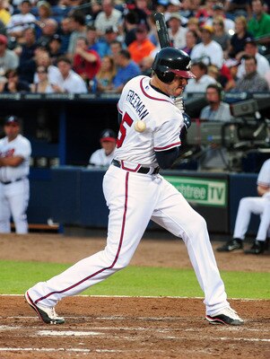 ATLANTA - JUNE 20: Freddie Freeman #5 of the Atlanta Braves is hit by a pitch by Ricky Romero #24 of the Toronto Blue Jays at Turner Field on June 20, 2011 in Atlanta, Georgia. (Photo by Scott Cunningham/Getty Images)