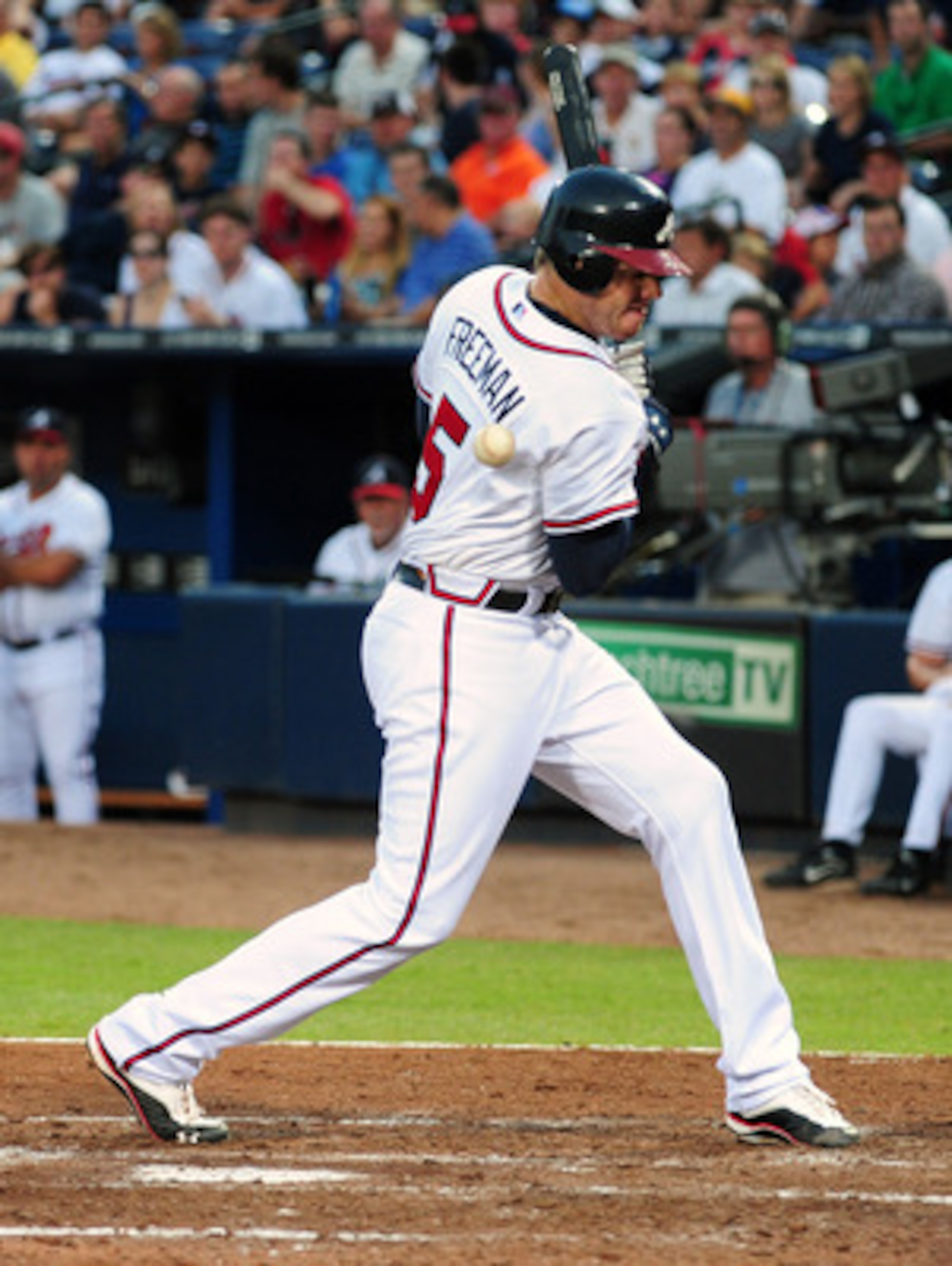 ATLANTA - JUNE 20: Freddie Freeman #5 of the Atlanta Braves is hit by a pitch by Ricky Romero #24 of the Toronto Blue Jays at Turner Field on June 20, 2011 in Atlanta, Georgia. (Photo by Scott Cunningham/Getty Images)