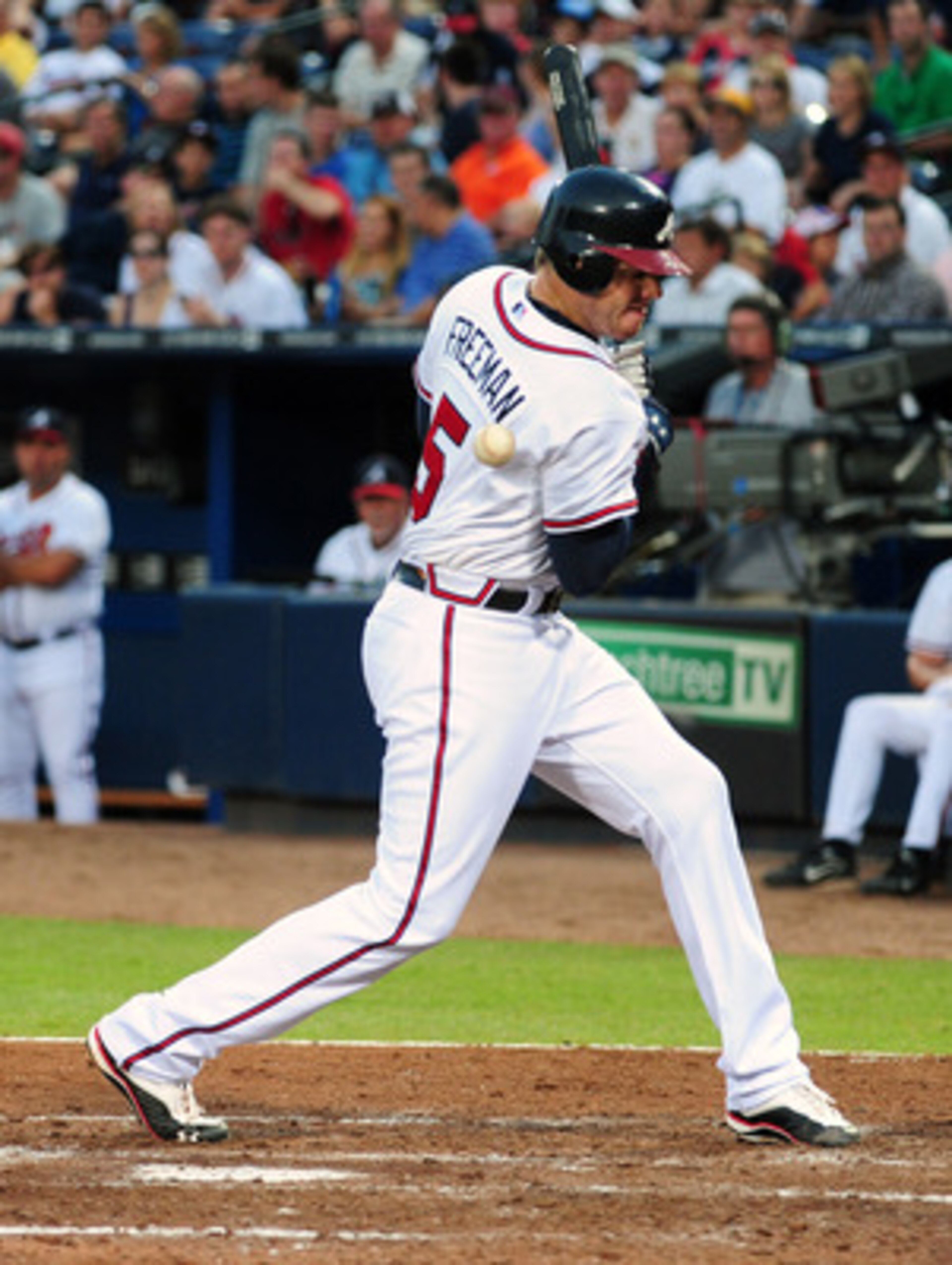 ATLANTA - JUNE 20: Freddie Freeman #5 of the Atlanta Braves is hit by a pitch by Ricky Romero #24 of the Toronto Blue Jays at Turner Field on June 20, 2011 in Atlanta, Georgia. (Photo by Scott Cunningham/Getty Images)