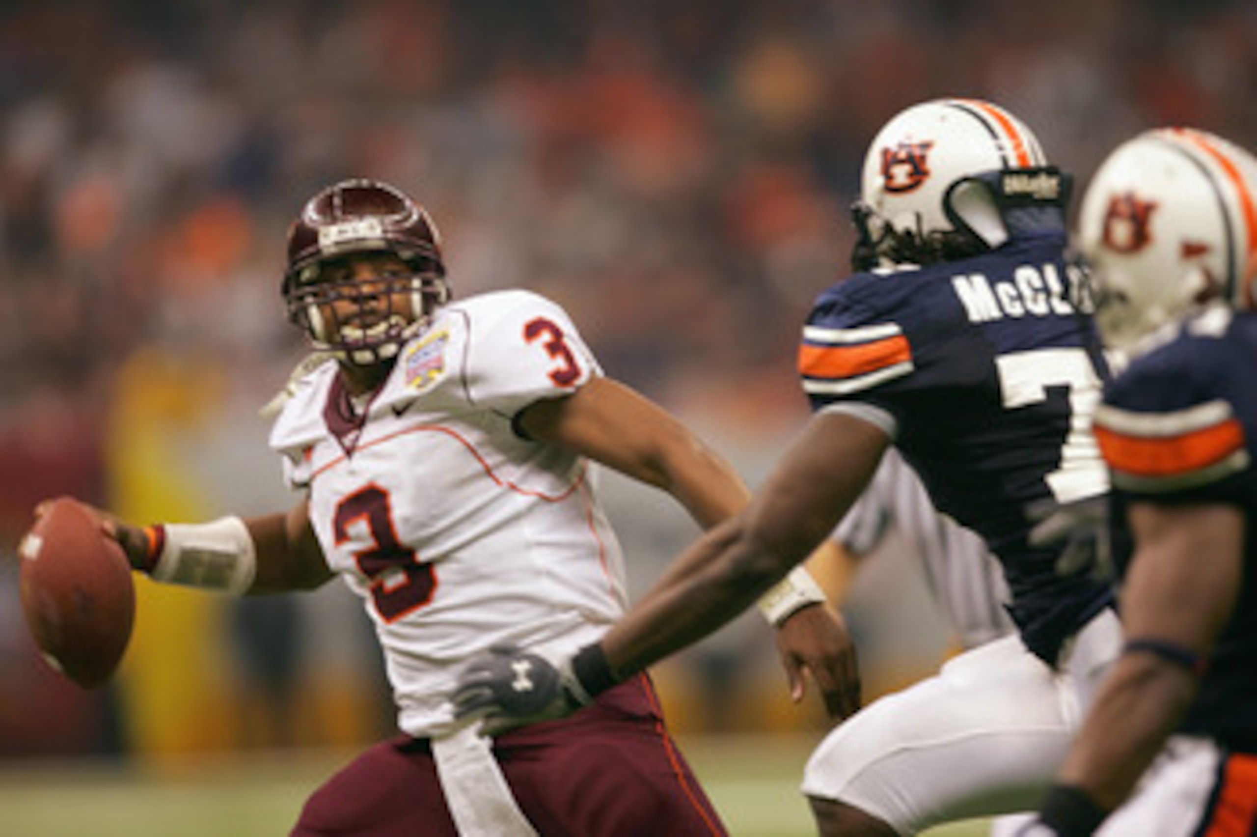 NEW ORLEANS - JANUARY 3:  Quarterback Bryan Randall #3 of the Virginia Tech Hokies looks to pass against defensive end Stanley McClover #75 of the Auburn Tigers during the Nokia Sugar Bowl on January 3, 2005 at the Superdome in New Orleans, Louisiana.  Th