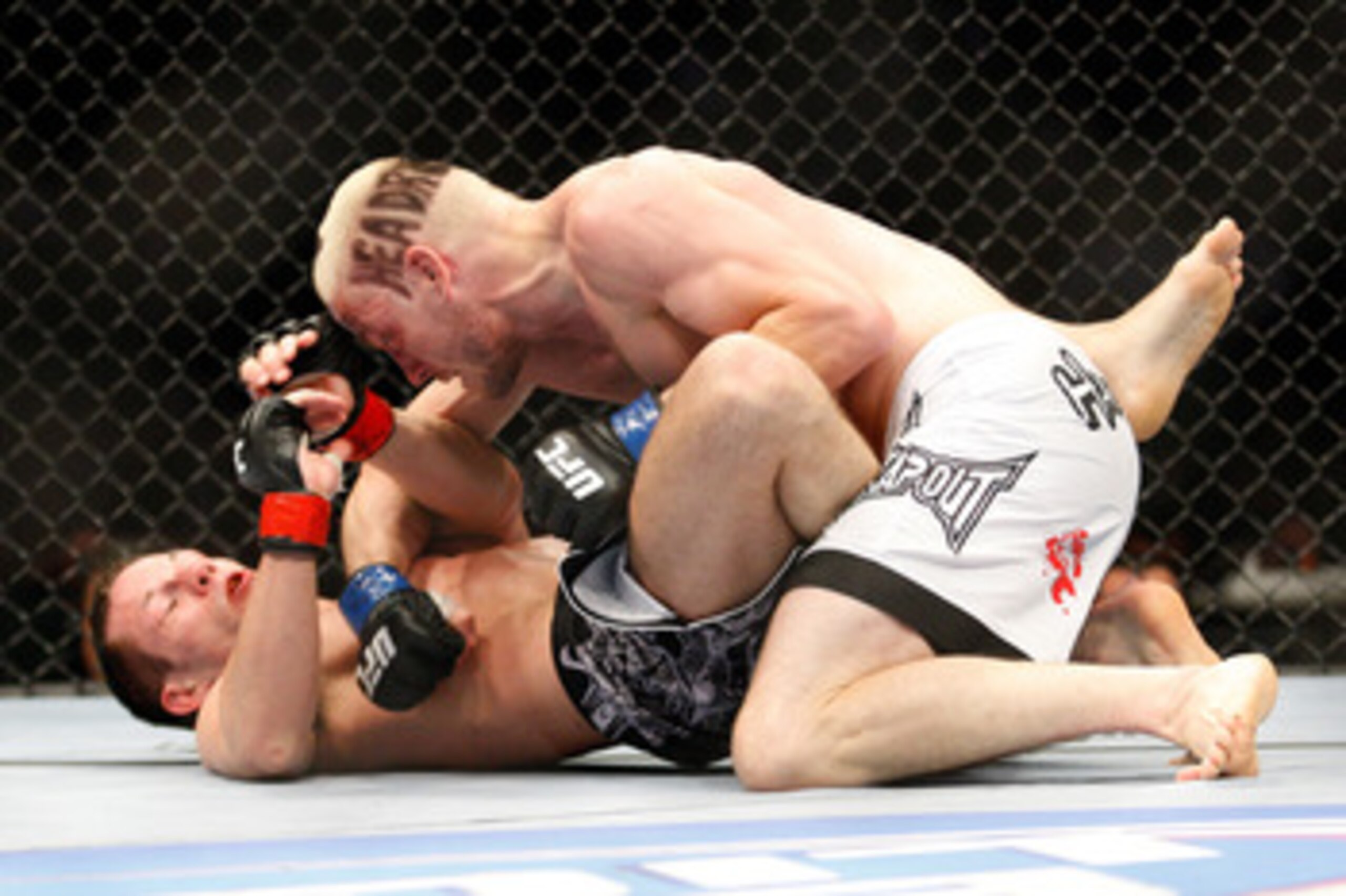 MONTREAL- MAY 8: Jonathan Goulet (top) punches Marcus Davis in their welterweight bout at UFC 113 at Bell Centre on May 8, 2010 in Montreal, Quebec, Canada. (Photo by Richard Wolowicz/Getty Images) MONTREAL- MAY 8: Jonathan Goulet (top) punches Marcus Davis in their welterweight bout at UFC 113 at Bell Centre on May 8, 2010 in Montreal, Quebec, Canada. (Photo by Richard Wolowicz/Getty Images)