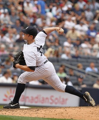 NEW YORK, NY - JUNE 16:  David Robertson #30 of the New York Yankees in action against the Texas Rangers during their game on June 16, 2011 at Yankee Stadium in the Bronx borough of New York City.  (Photo by Al Bello/Getty Images)
