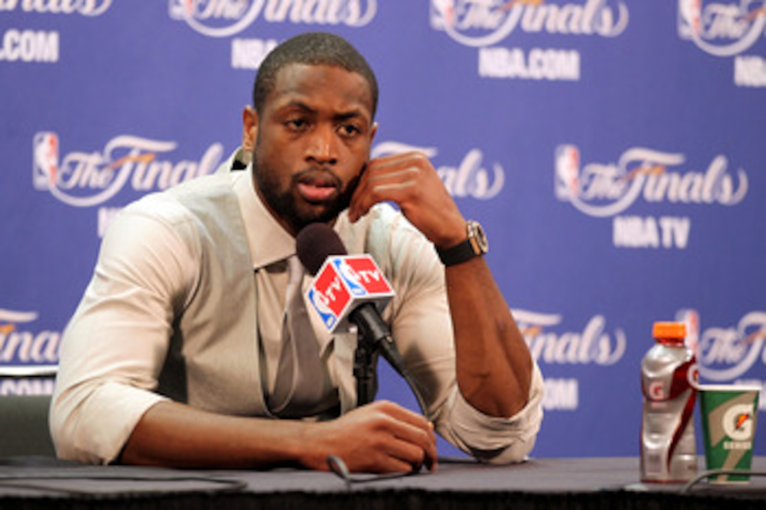 MIAMI, FL - JUNE 12:   Dwyane Wade #3 of the Miami Heat answers questions from the media at a post game news conference after the Dallas Mavericks won 105-95 in Game Six of the 2011 NBA Finals at American Airlines Arena on June 12, 2011 in Miami, Florida.