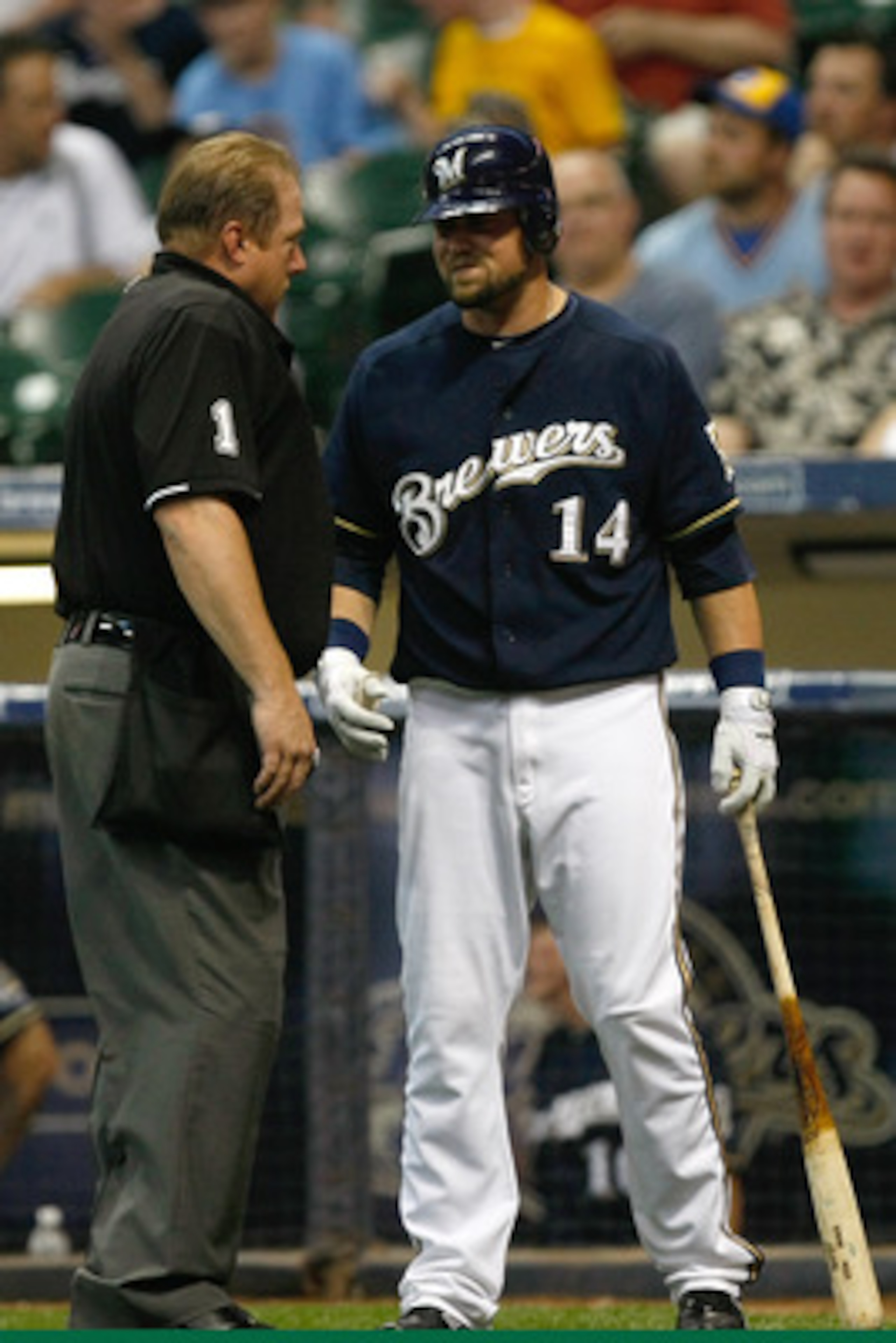 MILWAUKEE, WI - JUNE 8: Casey McGehee #14 of the Milwaukee Brewers argues a call with umpire Bruce Dreckman #1 during the game against the New York Mets at Miller Park on June 8, 2011 in Milwaukee, Wisconsin. The Brewers defeated the Mets 7-6. (Photo by S