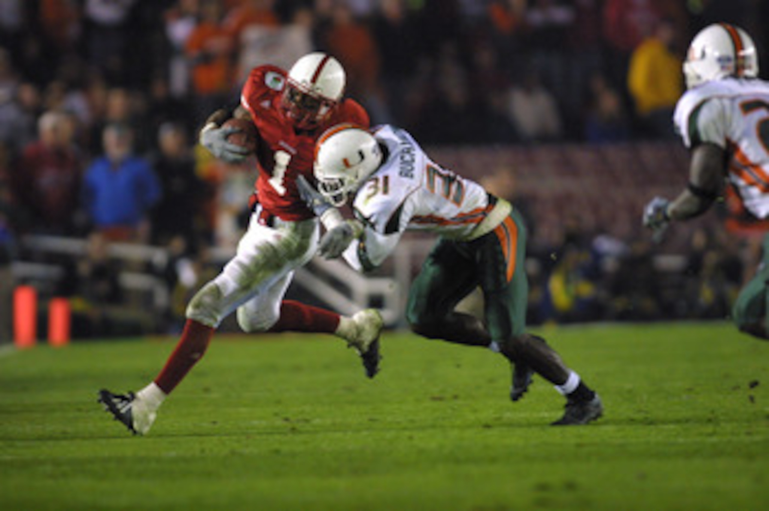 3 Jan 2002:   Nebraska running back Thunder Collins #1 is tackled by  Miami cornerback Phillip Buchanon #31 during the Rose Bowl National Championship Game at the Rose Bowl in Pasadena, California.  Miami won 37-14.  DIGITAL IMAGE    Mandatory Credit:  St