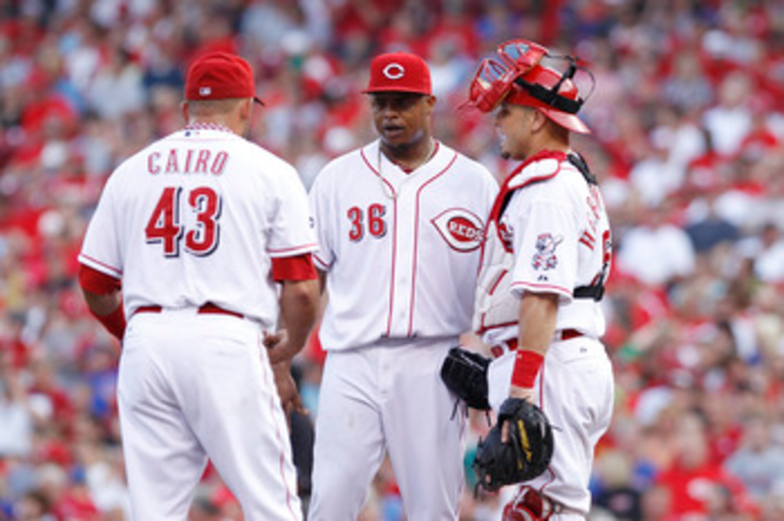 CINCINNATI, OH - JUNE 7: Edinson Volquez #36 of the Cincinnati Reds meets at the mound with catcher Ramon Hernandez #55 and third baseman Miguel Cairo #43 during the game against the Chicago Cubs at Great American Ball Park on June 7, 2011 in Cincinnati,