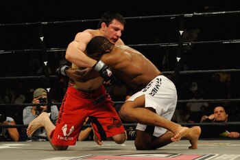 UNCASVILLE, CT - MAY 16:  Nick Calandrino (Red Trunks) of the Bomb Squad battles John Howard (White Trunks) during their bout presented by the International Fighting League at the Mohegan Sun Arena May 16, 2008 in Uncasville, Connecticut.  (Photo by Jeff 