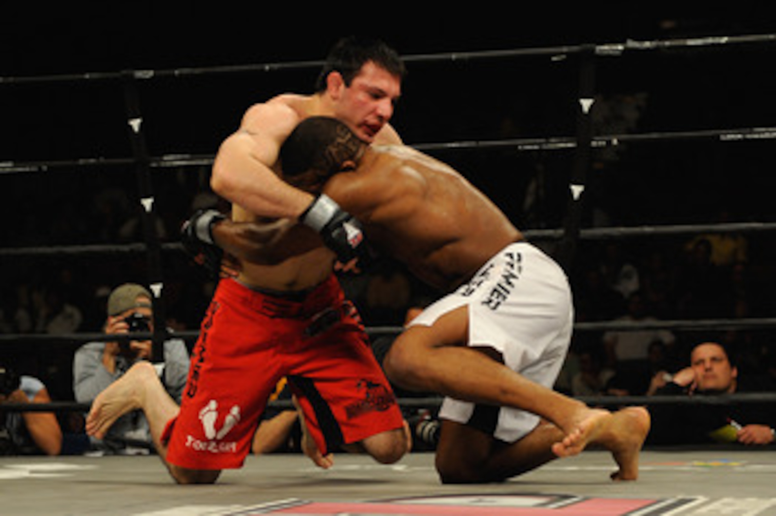 UNCASVILLE, CT - MAY 16: Nick Calandrino (Red Trunks) of the Bomb Squad battles John Howard (White Trunks) during their bout presented by the International Fighting League at the Mohegan Sun Arena May 16, 2008 in Uncasville, Connecticut. (Photo by Jeff UNCASVILLE, CT - MAY 16: Nick Calandrino (Red Trunks) of the Bomb Squad battles John Howard (White Trunks) during their bout presented by the International Fighting League at the Mohegan Sun Arena May 16, 2008 in Uncasville, Connecticut. (Photo by Jeff