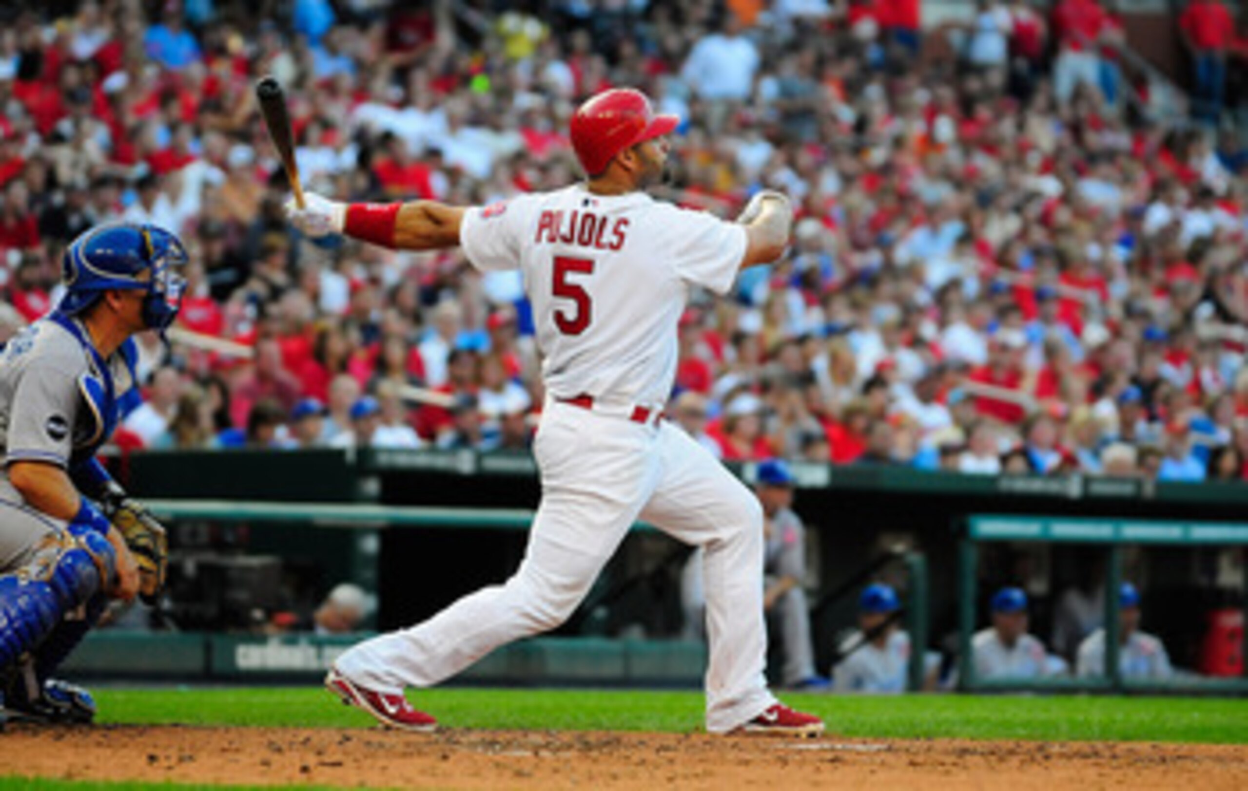 ST. LOUIS, MO - JUNE 18: Albert Pujols #5 of the St. Louis Cardinals follows through on a one run double against the Kansas City Royals at Busch Stadium on June 18, 2011 in St. Louis, Missouri.  (Photo by Jeff Curry/Getty Images)