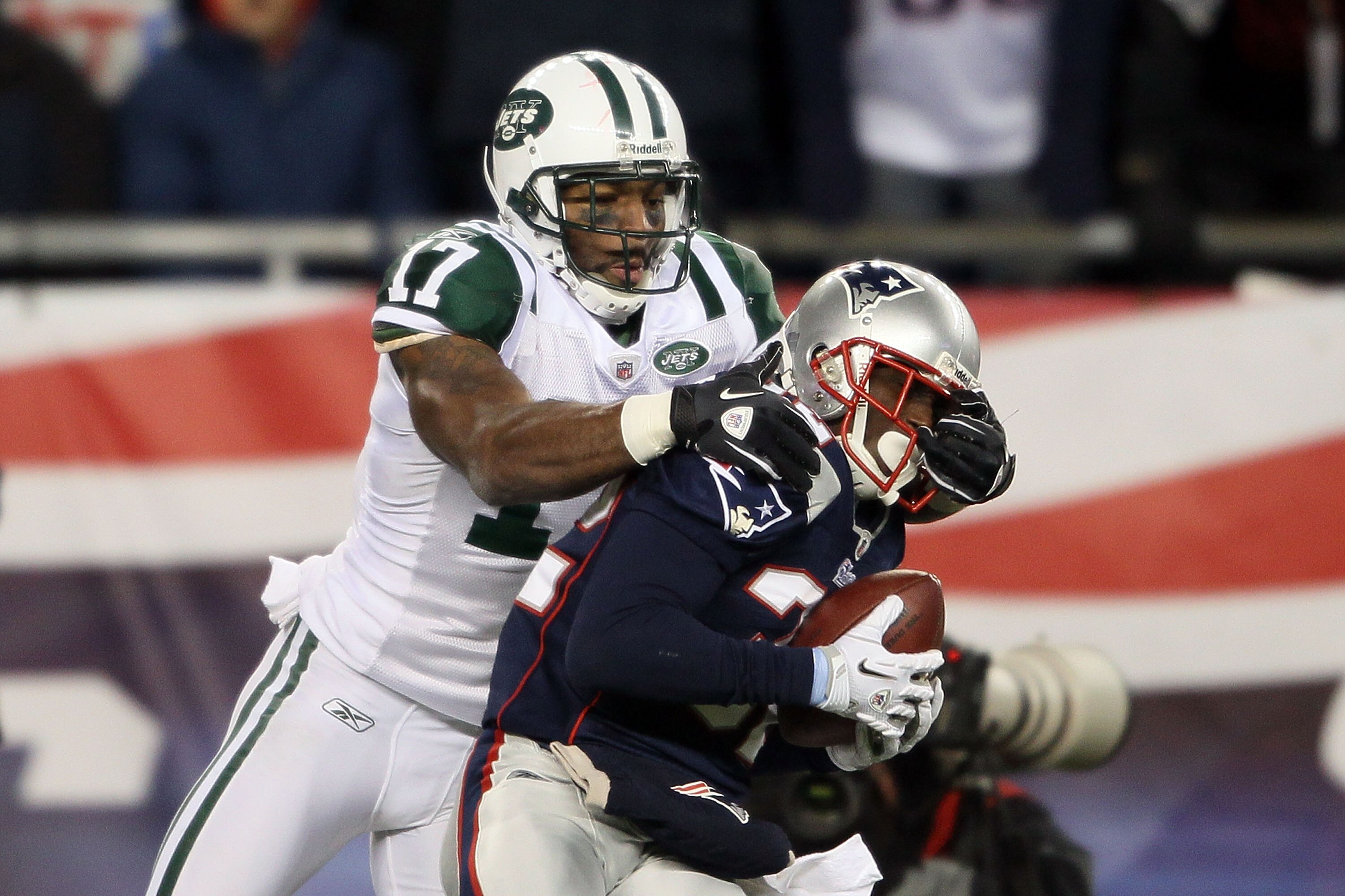 FOXBORO, MA - DECEMBER 06:  Devin McCourty #32 of the New England Patriots intercepts a pass against Braylon Edwards #17 of the New York Jets at Gillette Stadium on December 6, 2010 in Foxboro, Massachusetts. The Patriots won 45-3. (Photo by Elsa/Getty Im