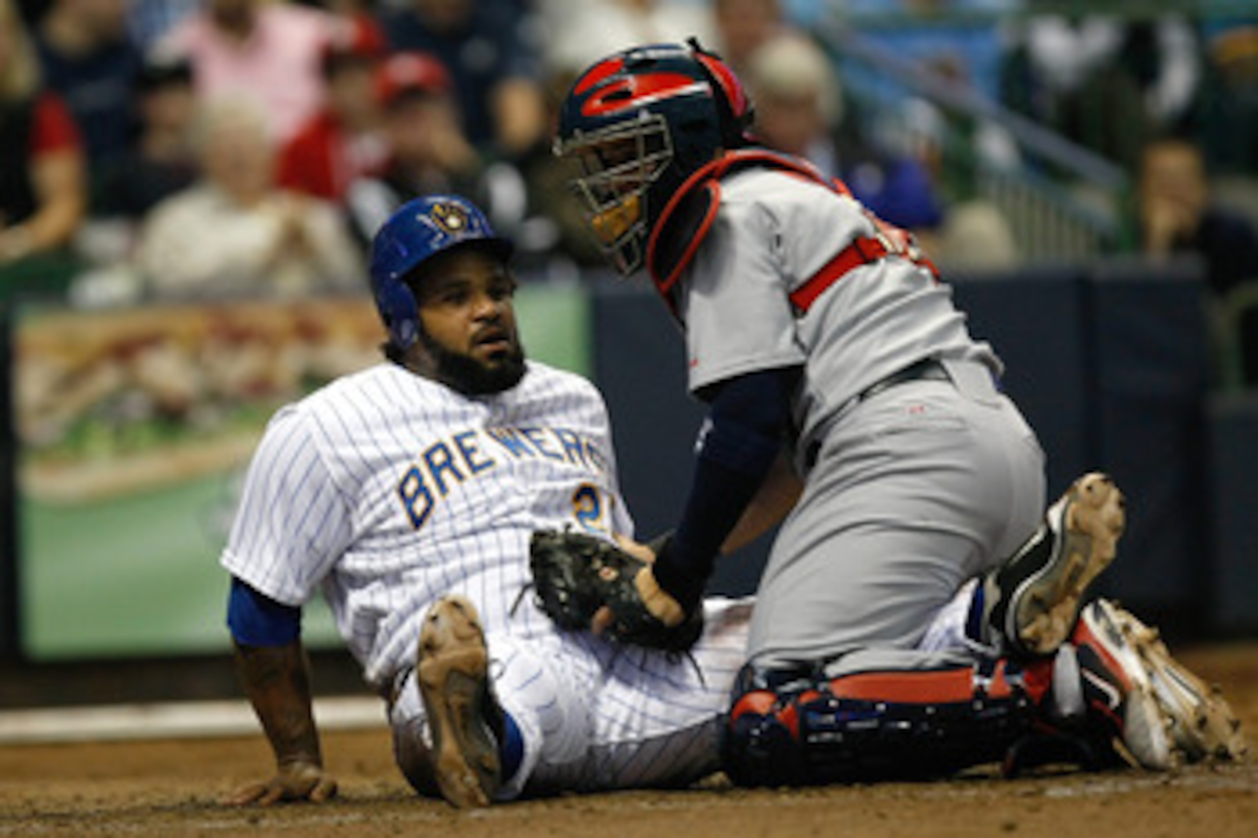 MILWAUKEE, WI - JUNE 10: Yadier Molina #4 of the St. Louis Cardinals tags out Prince Fielder #28 of the Milwaukee Brewers at home plate at Miller Park on June 10, 2011 in Milwaukee, Wisconsin. (Photo by Scott Boehm/Getty Images)