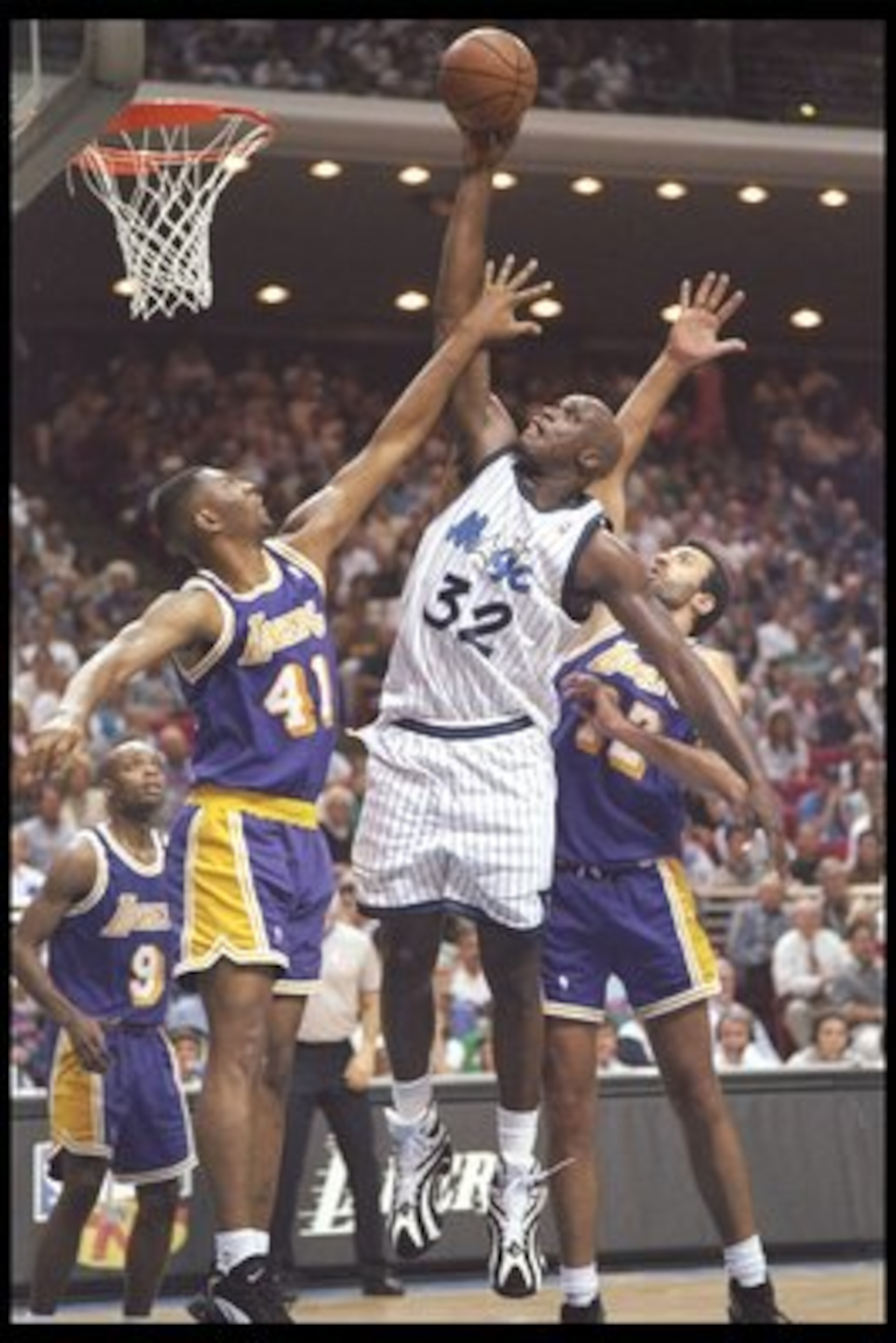 26 Mar 1996: Center Shaquille O''Neal of the Orlando Magic fights for a rebound with center Vlade Divac and forward Eldon Campbell of the Los Angeles Lakers at the Orlando Arena in Orlando, Florida. The Lakers won the game 113-91.