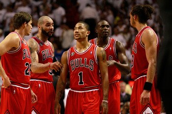 MIAMI, FL - MAY 24:  (L-R) Kyle Korver #26, Carlos Boozer #5, Derrick Rose #1, Luol Deng #9 and Joakim Noah #13 of the Chicago Bulls talk on court against the Miami Heat in Game Four of the Eastern Conference Finals during the 2011 NBA Playoffs on May 24,