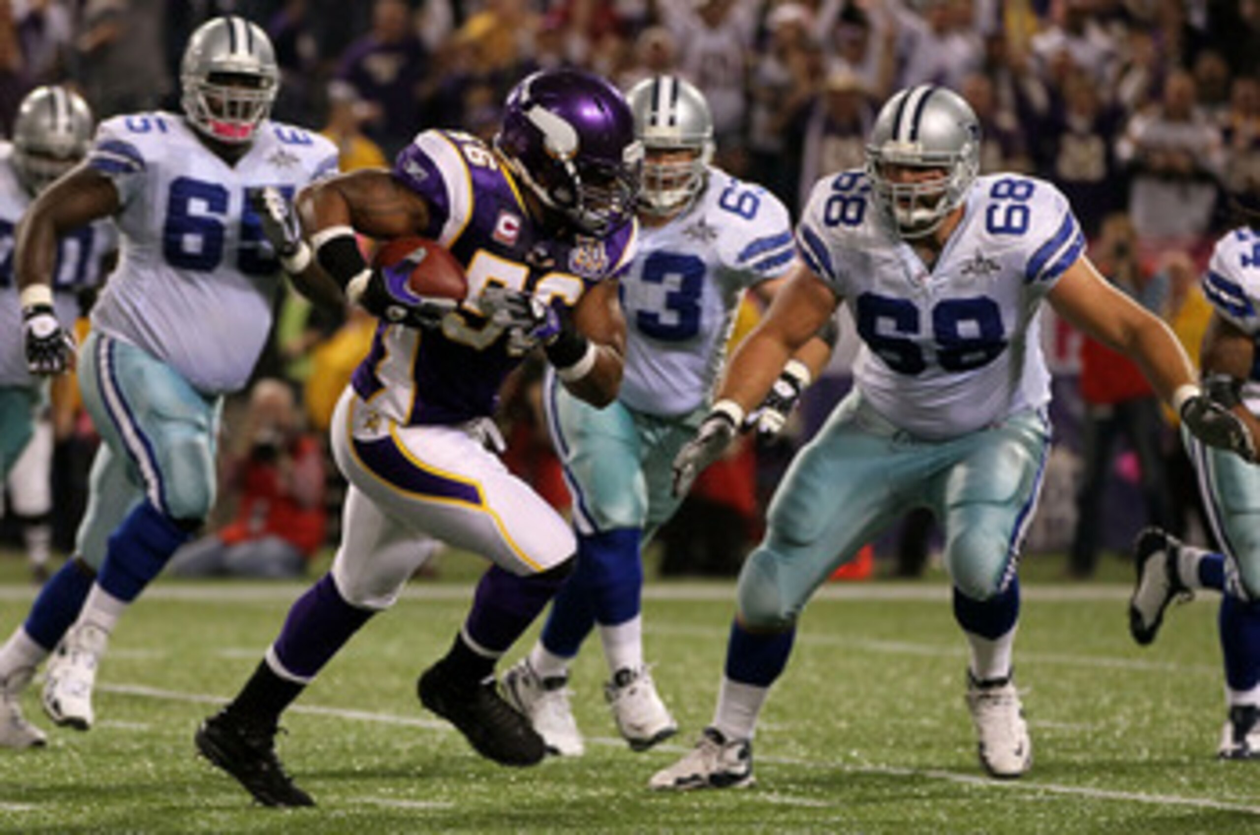 MINNEAPOLIS - OCTOBER 17:  E.J. Henderson #56 of the Minnesota Vikings intercepts a pass against the Dallas Cowboys during the game at Mall of America Field on October 17, 2010 in Minneapolis, Minnesota. The Vikings defeated the Cowboys 24-21.  (Photo by