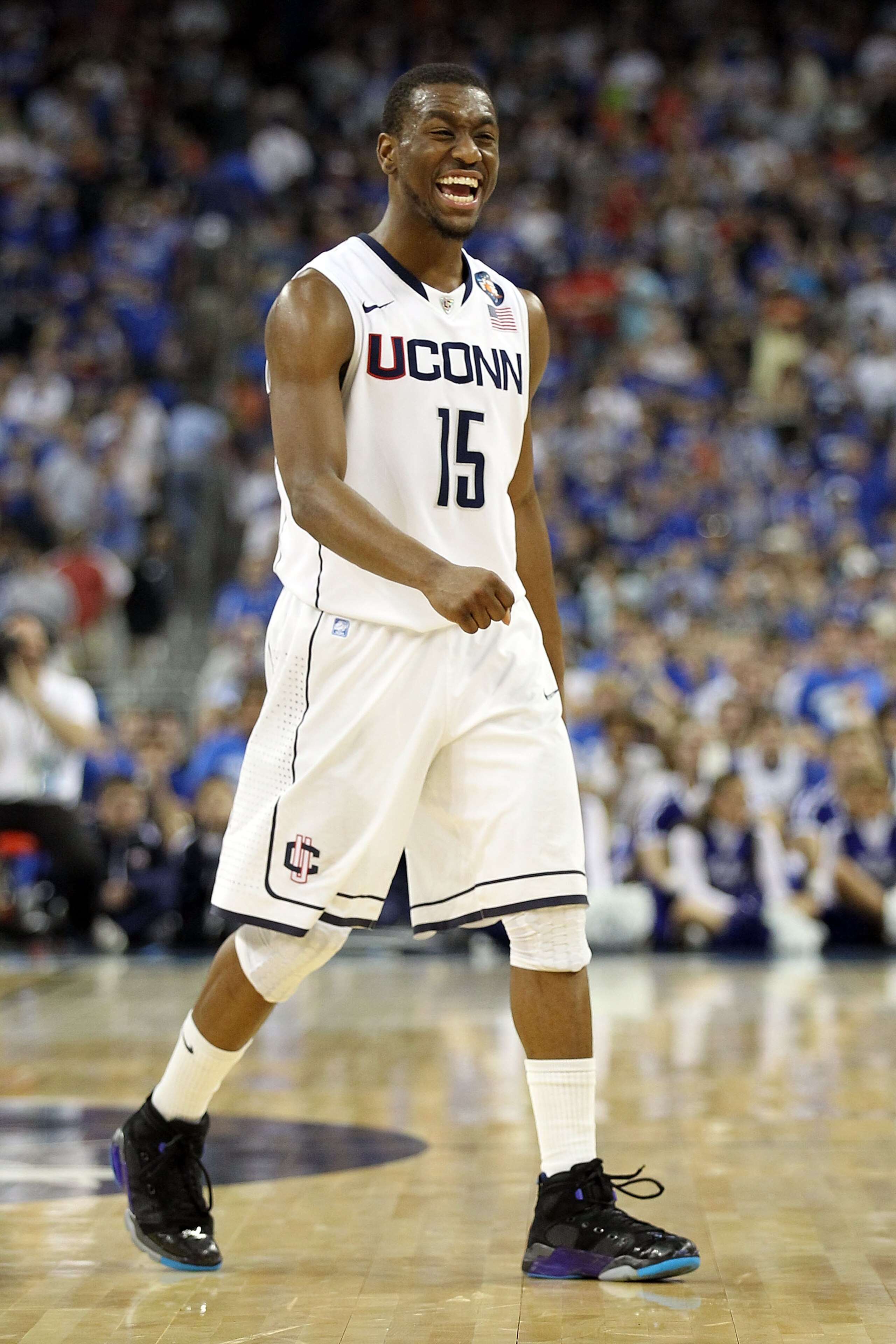 HOUSTON, TX - APRIL 02:  Kemba Walker #15 of the Connecticut Huskies reacts towards the end of the game against the Kentucky Wildcats during the National Semifinal game of the 2011 NCAA Division I Men's Basketball Championship at Reliant Stadium on April 