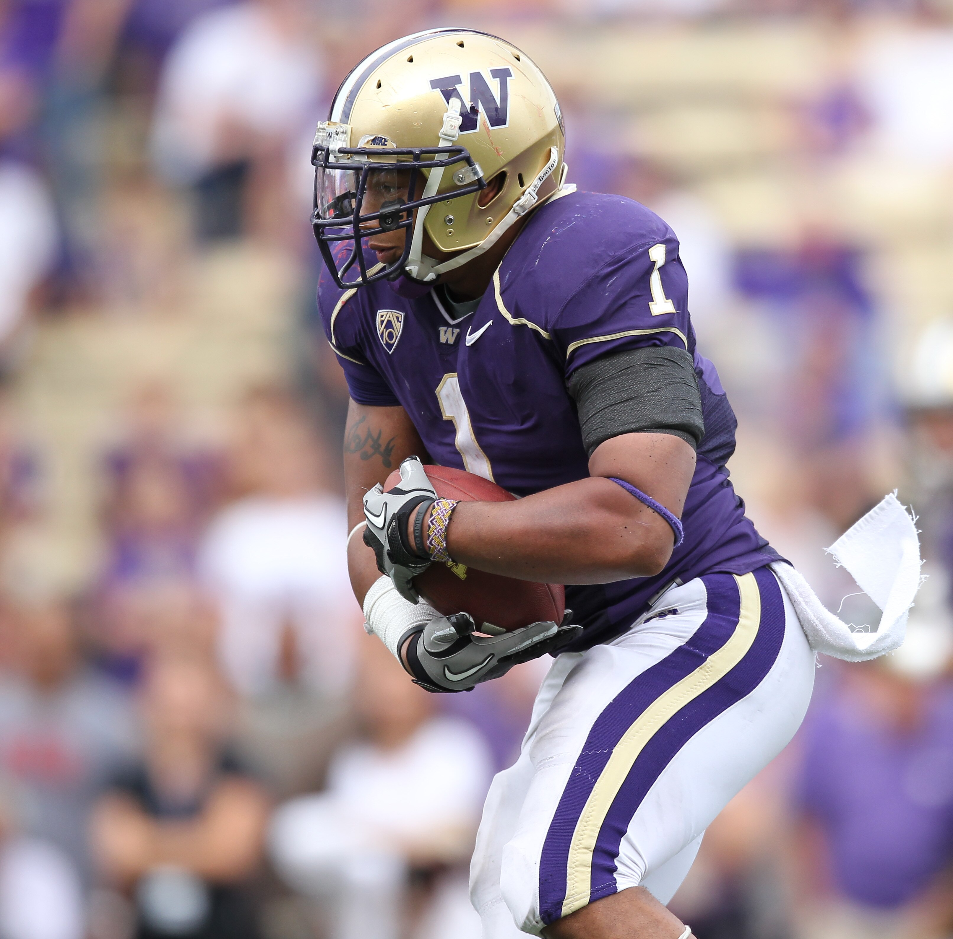 SEATTLE - SEPTEMBER 18: Running back Chris Polk #1 of the Washington Huskies rushes against the Nebraska Cornhuskers on September 18, 2010 at Husky Stadium in Seattle, Washington. (Photo by Otto Greule Jr/Getty Images)