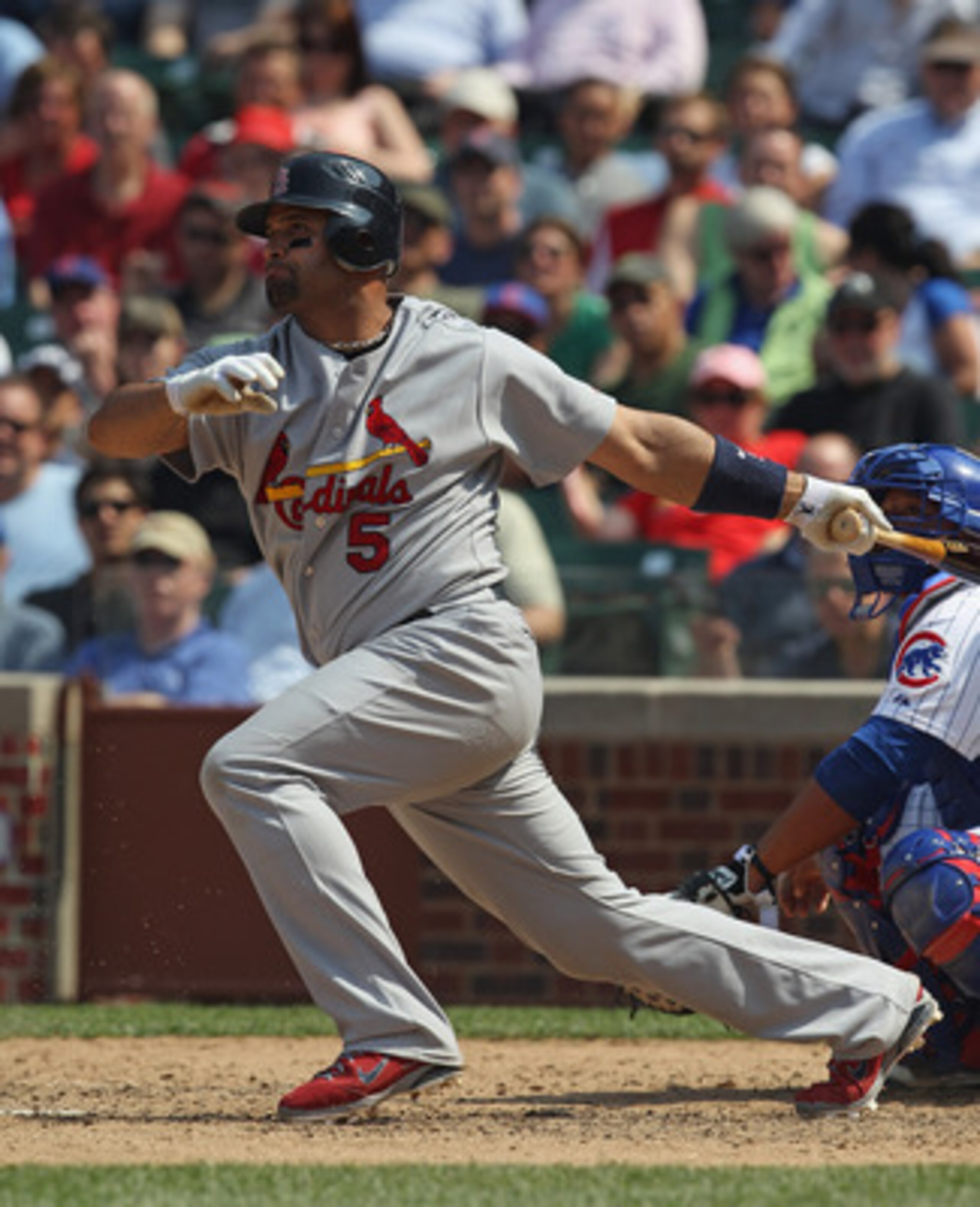 CHICAGO, IL - MAY 12:  Albert Pujols #5 of the St. Louis Cardinals hits the ball against the Chicago Cubs at Wrigley Field on May 12, 2011 in Chicago, Illinois. The Cardinals defeated the Cubs 9-1.  (Photo by Jonathan Daniel/Getty Images)