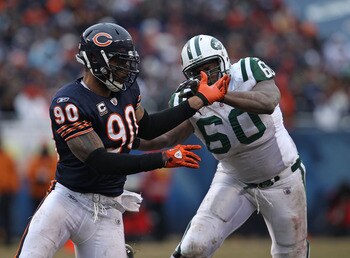 CHICAGO, IL - DECEMBER 26: Julius Peppers #90 of the Chicago Bears rushes against D' Brickashaw Ferguson #60 of the New York Jets at Soldier Field on December 26, 2010 in Chicago, Illinois. The Bears defeated the Jets 38-34. (Photo by Jonathan Daniel/Gett