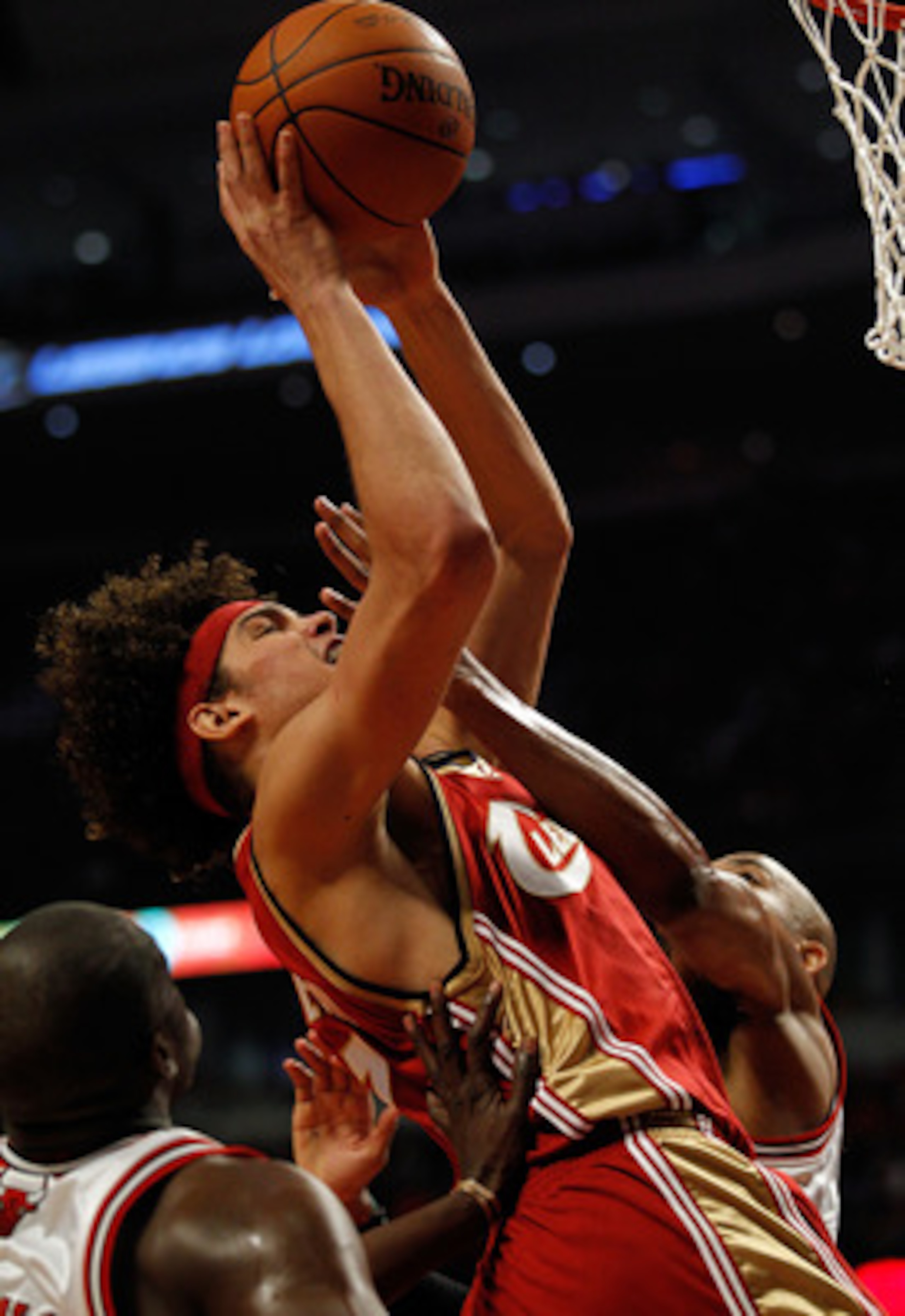 CHICAGO - APRIL 25: Anderson Varejao #17 of the Cleveland Cavaliers is fouled while shooting by Taj Gibson #22 of the Chicago Bulls in Game Four of the Eastern Conference Quarterfinals during the 2010 NBA Playoffs at the United Center on April 25, 2010 in