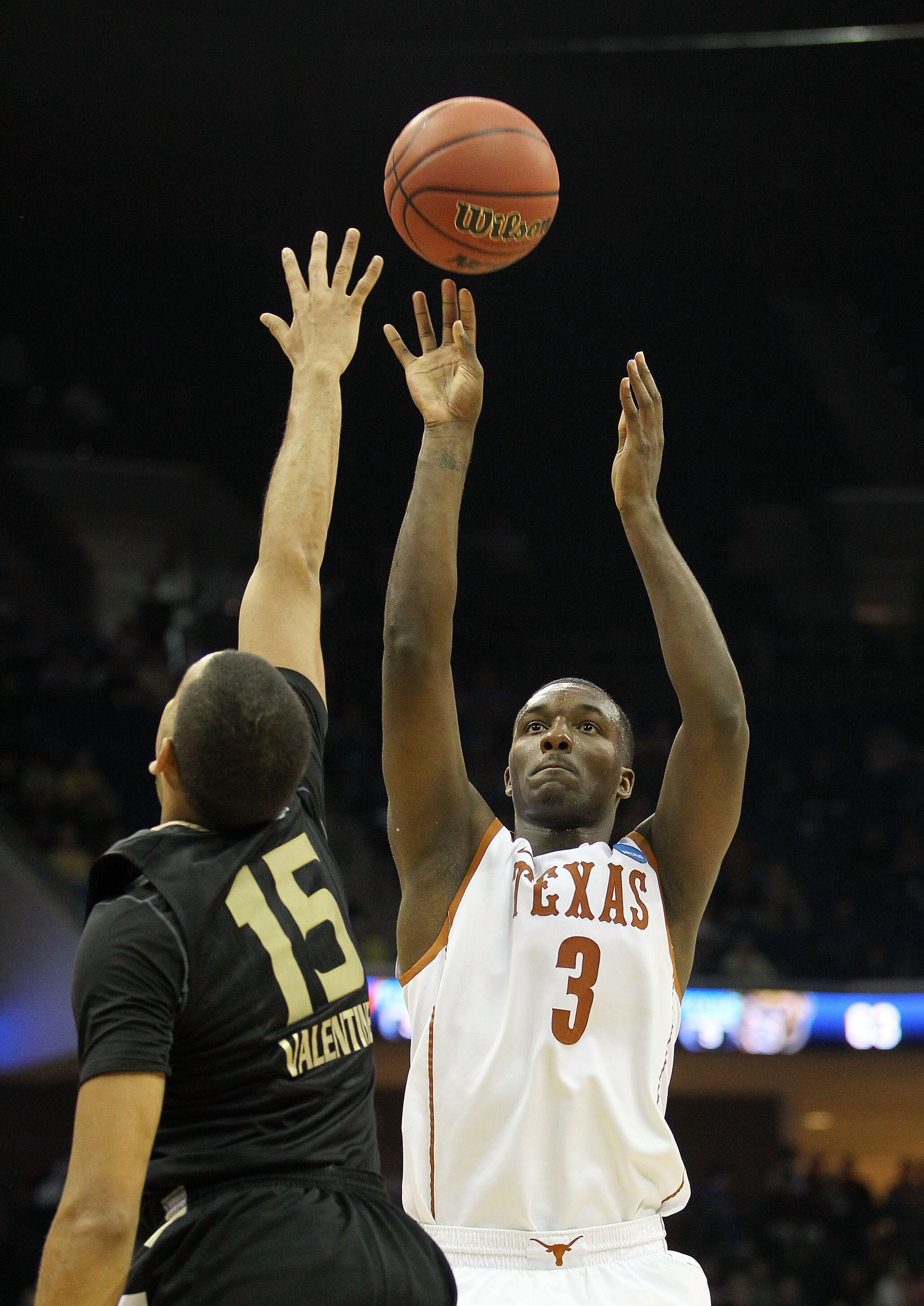 TULSA, OK - MARCH 18:  Jordan Hamilton #3 of the Texas Longhorns takes a shot as Drew Valentine #15 of the Oakland Golden Grizzlies defends during the second round of the 2011 NCAA men's basketball tournament at BOK Center on March 18, 2011 in Tulsa, Okla