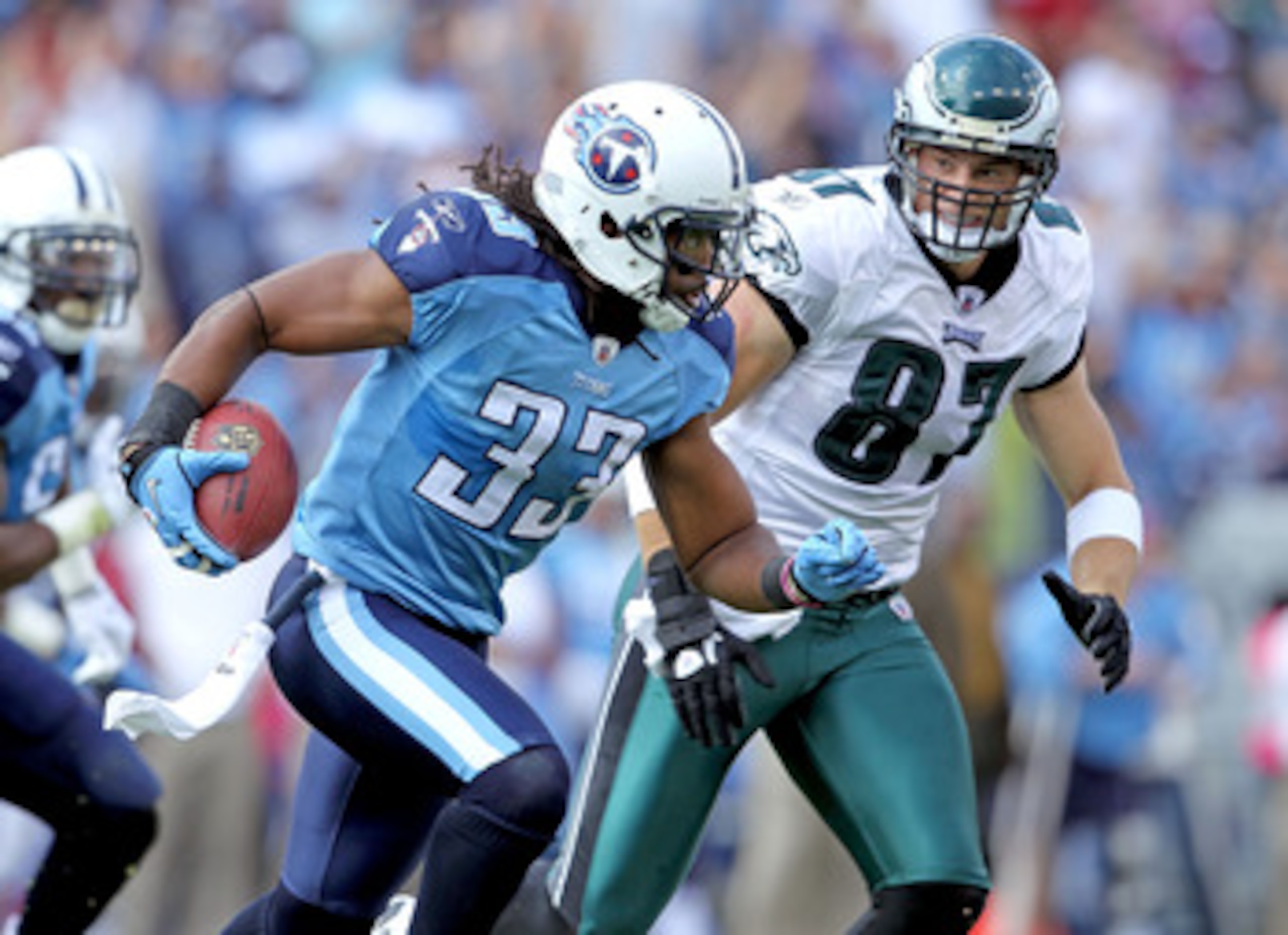 NASHVILLE, TN - OCTOBER 24: Michael Griffin #33 of the Tennessee Titans runs with the ball after intercepting a pass while defended by Brent Celek #87 of the Philadelphia Eagles at LP Field on October 24, 2010 in Nashville, Tennessee. The Titans won 37-19