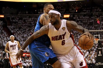 MIAMI, FL - JUNE 12:  LeBron James #6 of the Miami Heat drives against Shawn Marion #0 of the Dallas Mavericks in the second half of Game Six of the 2011 NBA Finals at American Airlines Arena on June 12, 2011 in Miami, Florida. NOTE TO USER: User expressl
