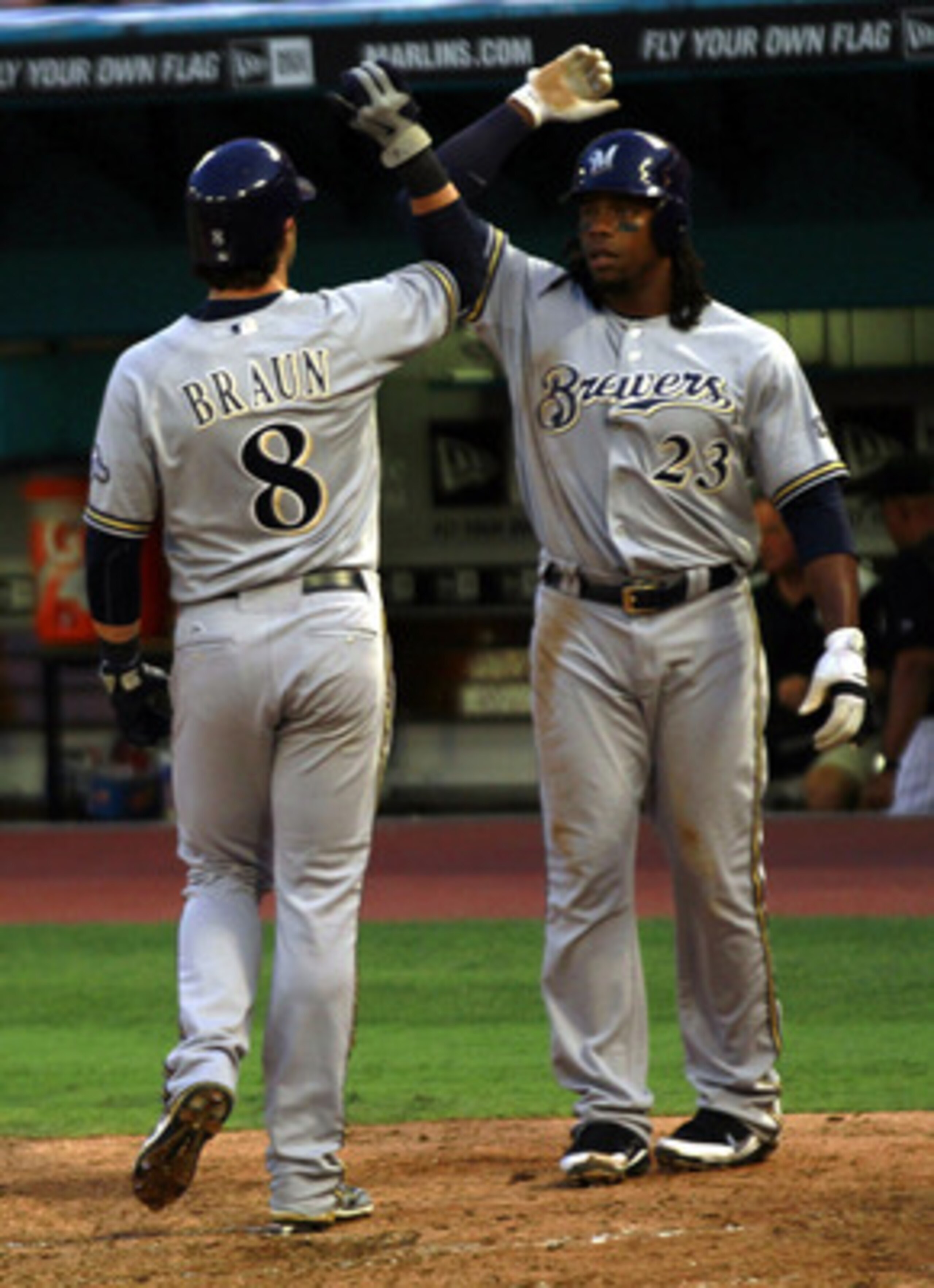 MIAMI GARDENS, FL - JUNE 06: Rickie weeks #23 of the Milwaukee Brewers celebrates a three run home runby Prince Fielder with teammate Ryan Braun #8 against the Florida Marlins at Sun Life Stadium on June 6, 2011 in Miami Gardens, Florida. (Photo by Marc MIAMI GARDENS, FL - JUNE 06: Rickie weeks #23 of the Milwaukee Brewers celebrates a three run home runby Prince Fielder with teammate Ryan Braun #8 against the Florida Marlins at Sun Life Stadium on June 6, 2011 in Miami Gardens, Florida. (Photo by Marc