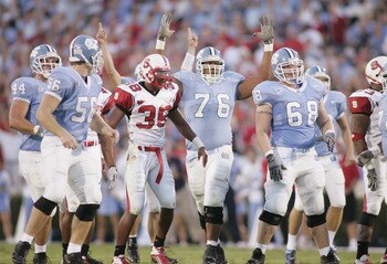 CHAPEL HILL, NC - OCTOBER 9: The North Carolina Tar Heels celebrate during the game against the North Carolina State Wolfpack on October 9, 2004 at Kenan Stadium Stadium in Chapel Hill, North Carolina. North Carolina defeated North Carolina State 30-24. CHAPEL HILL, NC - OCTOBER 9: The North Carolina Tar Heels celebrate during the game against the North Carolina State Wolfpack on October 9, 2004 at Kenan Stadium Stadium in Chapel Hill, North Carolina. North Carolina defeated North Carolina State 30-24.