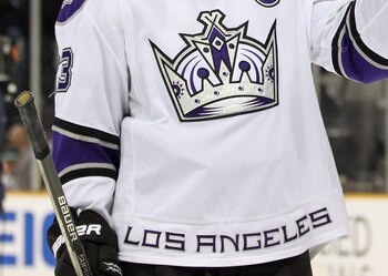 SAN JOSE, CA - APRIL 23:  Dustin Brown #23 and Justin Williams #14 of the Los Angeles Kings celebrate after they beat the San Jose Sharks in game five of the Western Conference Quarterfinals during the 2011 NHL Stanley Cup Playoffs at HP Pavilion on April