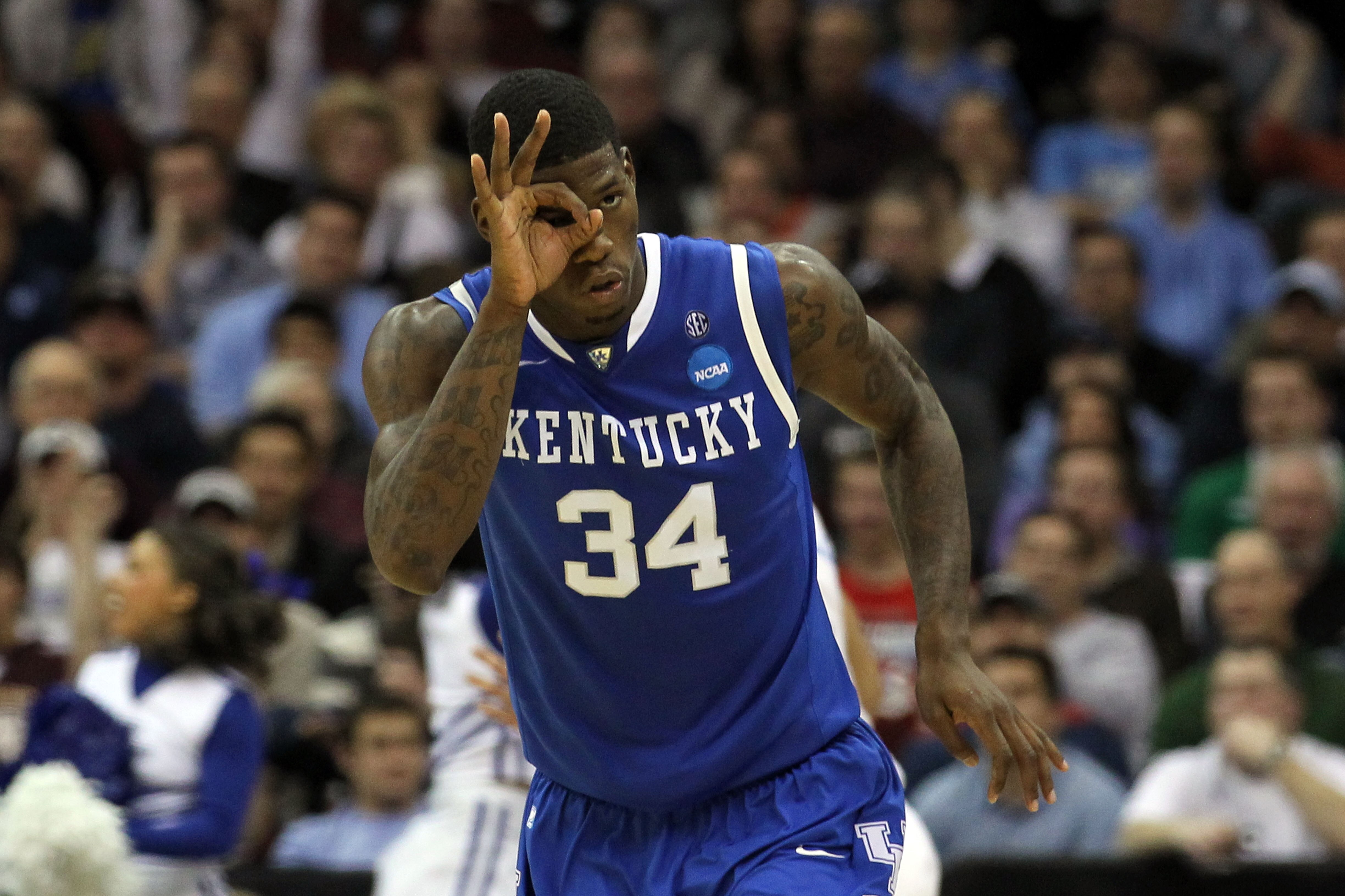 NEWARK, NJ - MARCH 27:  DeAndre Liggins #34 of the Kentucky Wildcats celebrates after a play against the North Carolina Tar Heels during the second half of the east regional final of the 2011 NCAA men's basketball tournament at Prudential Center on March
