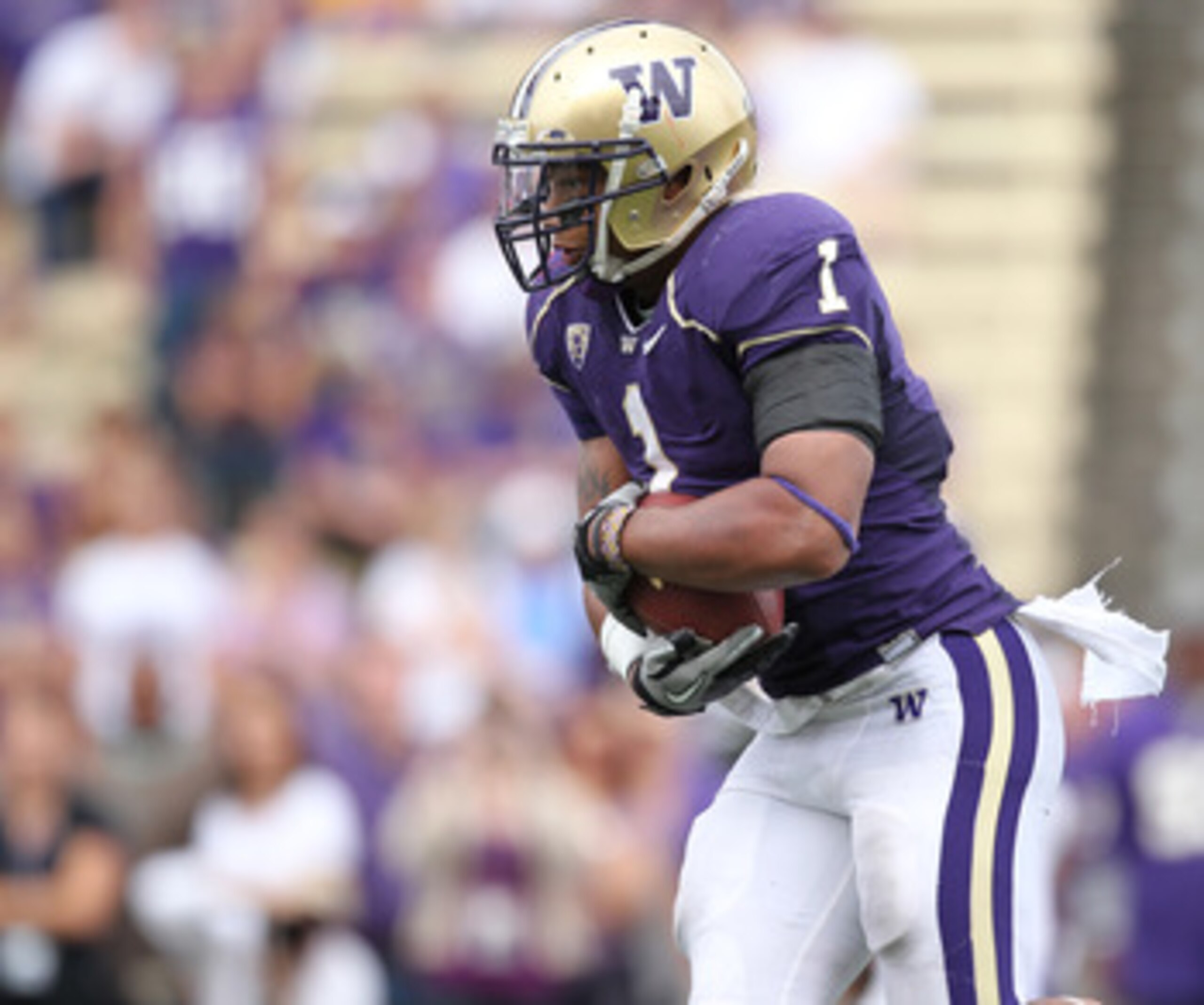 SEATTLE - SEPTEMBER 18: Running back Chris Polk #1 of the Washington Huskies rushes against the Nebraska Cornhuskers on September 18, 2010 at Husky Stadium in Seattle, Washington. (Photo by Otto Greule Jr/Getty Images)