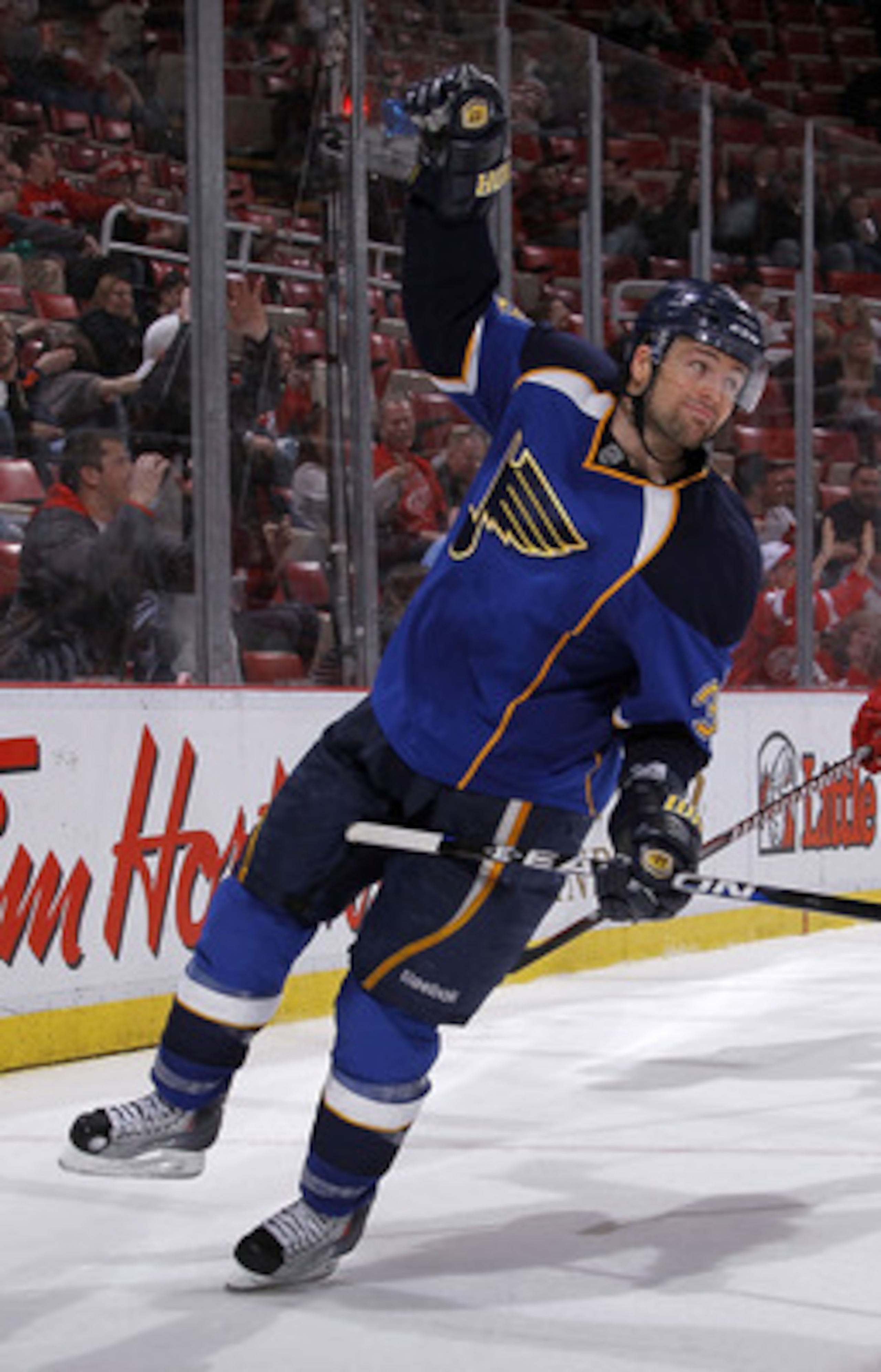 DETROIT, MI - MARCH 30:  Chris Porter #32 of the St. Louis Blues celebrates a third-period goal while playing the Detroit Red Wings at Joe Louis Arena on March 30, 2011 in Detroit, Michigan. St. Louis won the game 10-3.  (Photo by Gregory Shamus/Getty Ima