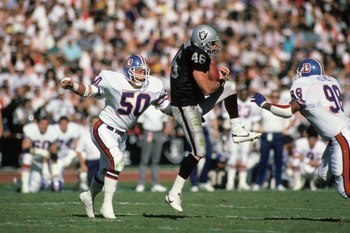 LOS ANGELES, CA - NOVEMBER 2:  Todd Christensen #46 of the Los Angeles Raiders makes a catch against Jim Ryan #50 of the Denver Broncos during the game at the Los Angeles Memorial Coliseum on November 2, 1986 in Los Angeles, California.  The Broncos won 2