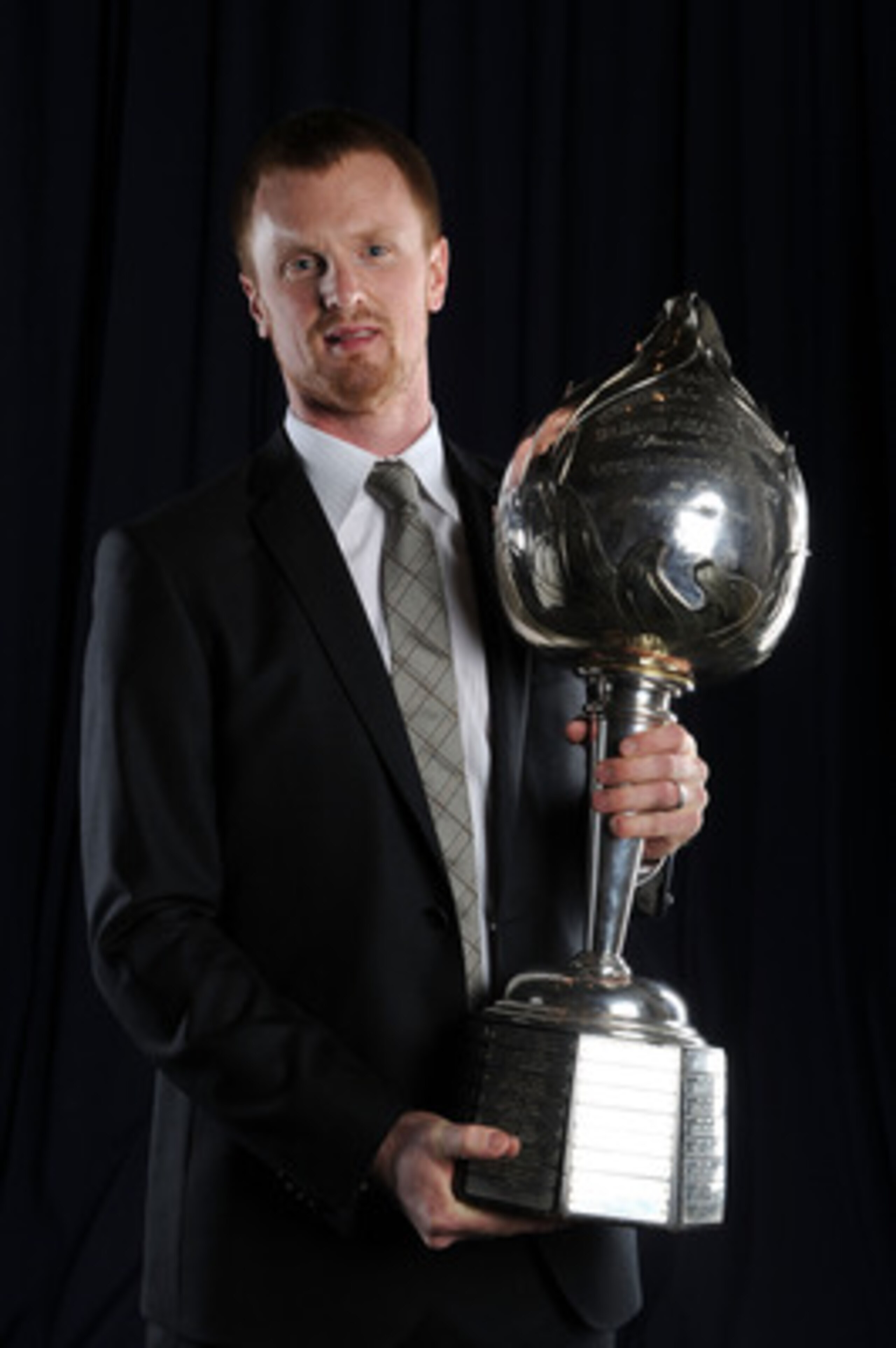 LAS VEGAS - JUNE 23:  Henrik Sedin of the Vancouver Canucks poses for a portrait with the Hart Memorial Trophy during the 2010 NHL Awards at the Palms Casino Resort on June 23, 2010 in Las Vegas, Nevada.  (Photo by Harry How/Getty Images)