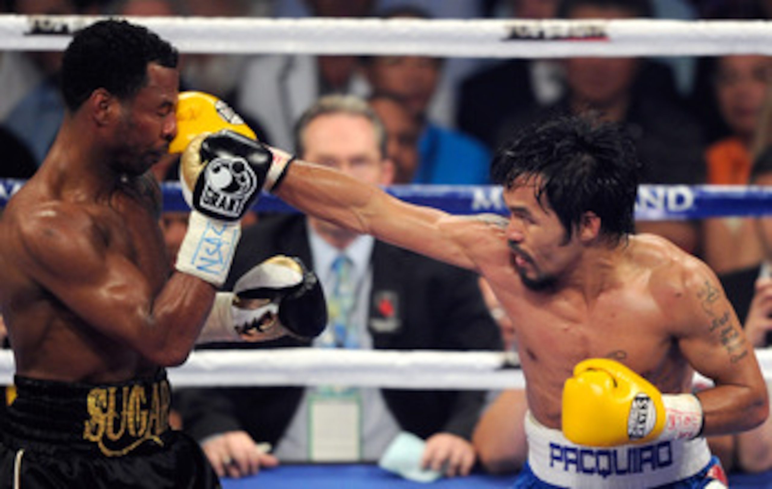 LAS VEGAS, NV - MAY 07:  Manny Pacquiao (R) hits Shane Mosley in the seventh round of their WBO welterweight title fight at the MGM Grand Garden Arena May 7, 2011 in Las Vegas, Nevada. Pacquiao retained his title with a unanimous-decision victory.  (Photo