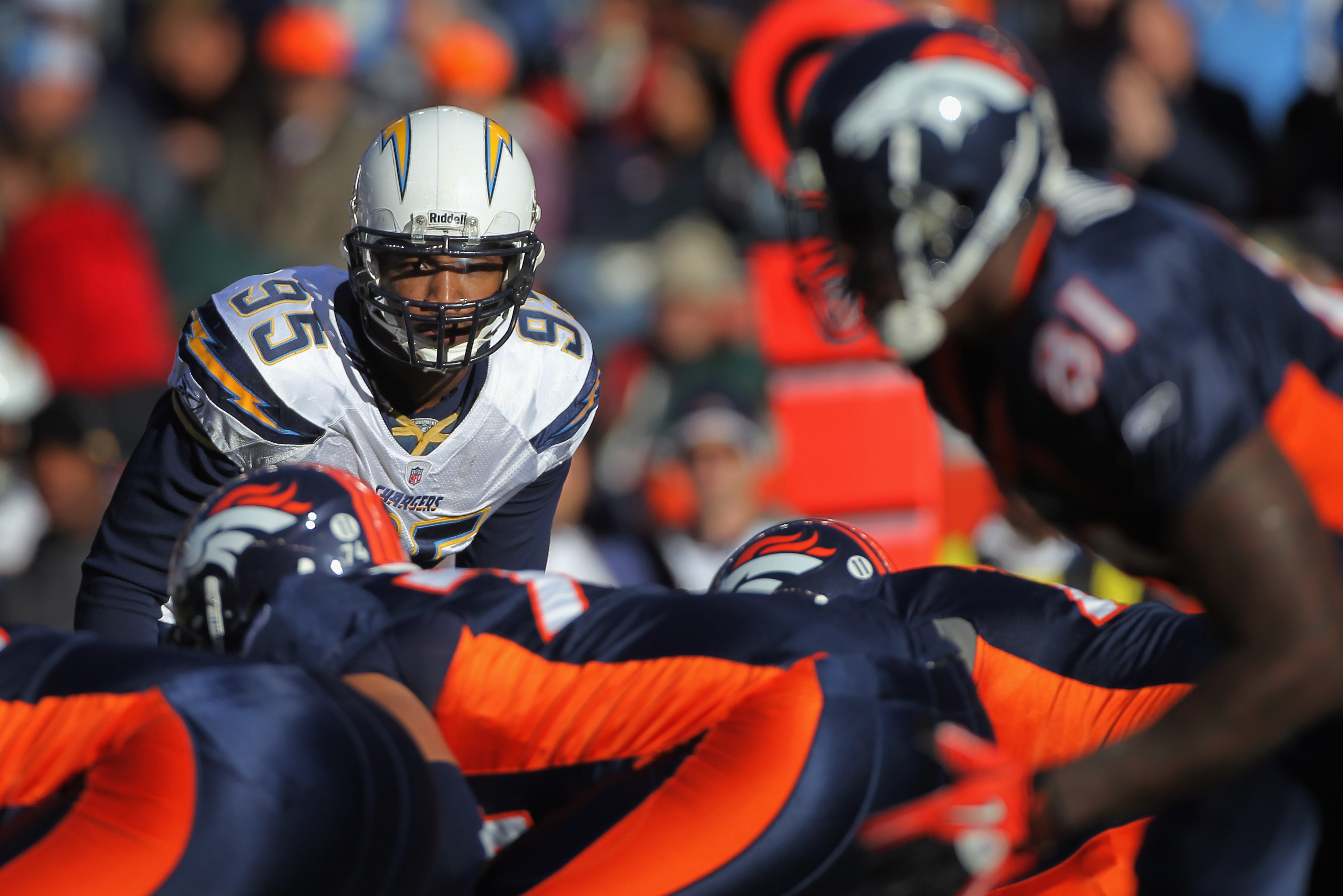 DENVER - JANUARY 02:  Outside linebacker Shaun Phillips #95 of the San Diego Chargers defends against the Denver Broncos at INVESCO Field at Mile High on January 2, 2011 in Denver, Colorado. The Chargers defeated the Broncos 33-28.  (Photo by Doug Pensing