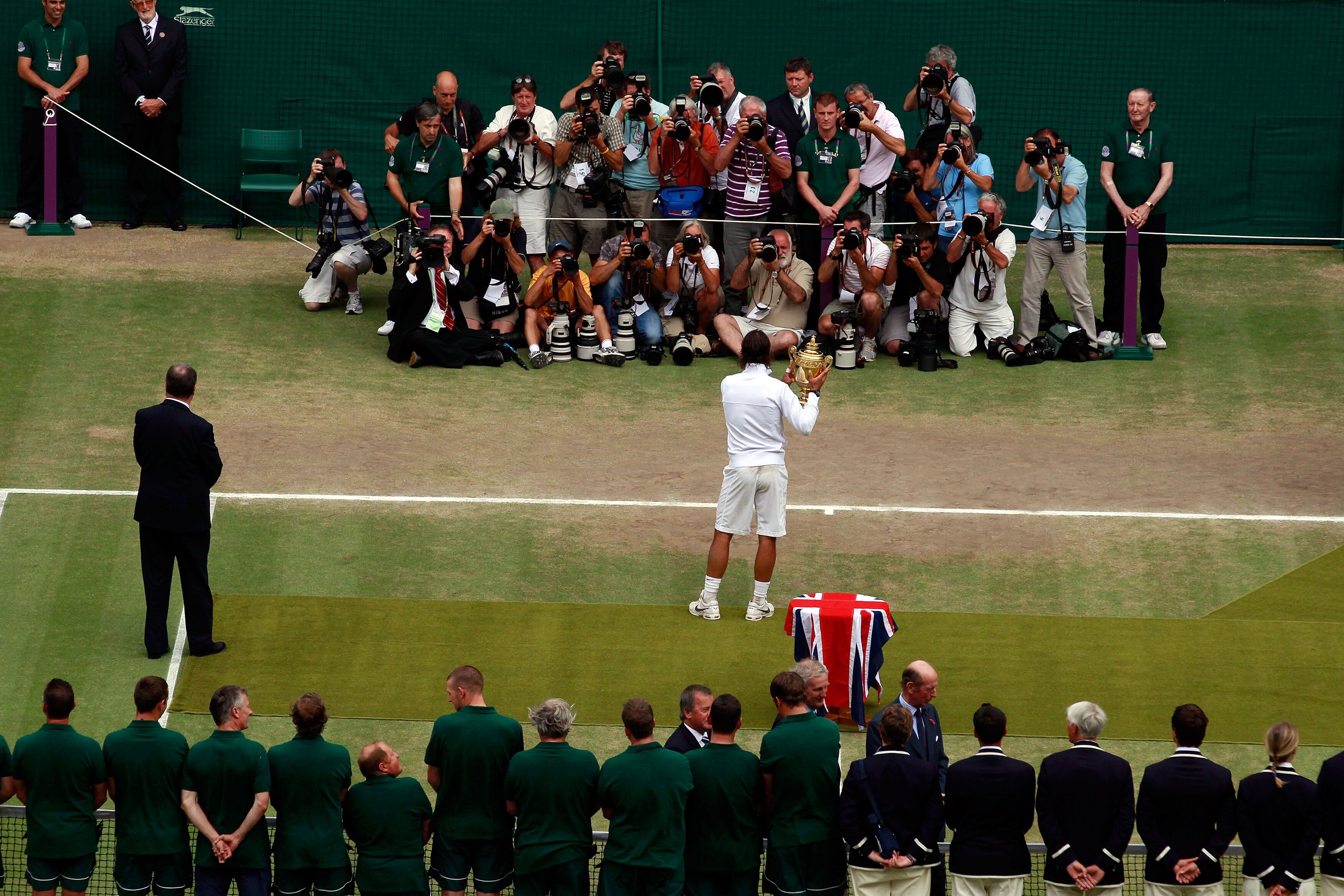 LONDON, ENGLAND - JULY 04:  Rafael Nadal of Spain holds the Championship trophy in front of the media after winning the Men's Singles Final match against Tomas Berdych of Czech Republic (R) on Day Thirteen of the Wimbledon Lawn Tennis Championships at the