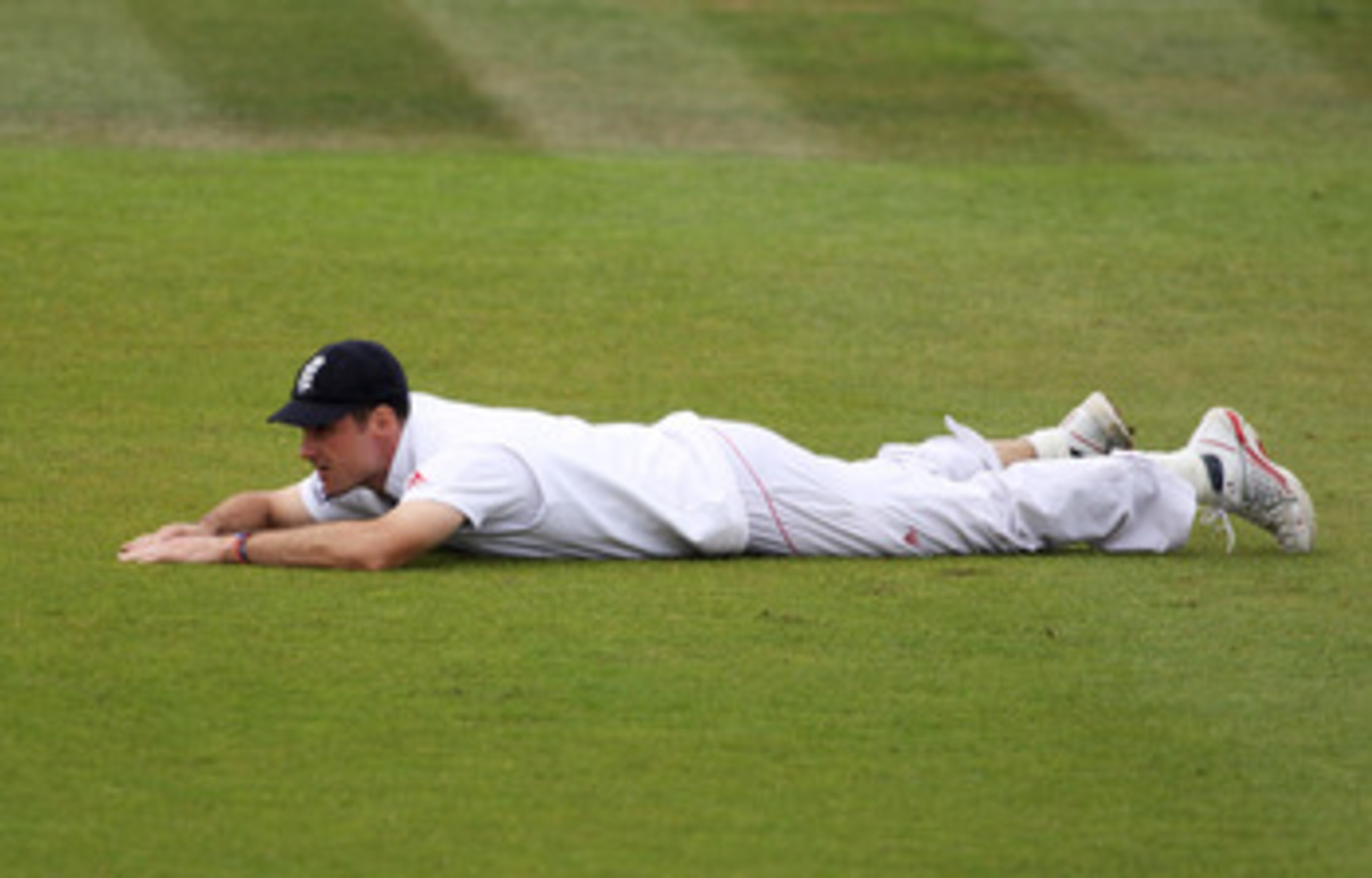 SOUTHAMPTON, ENGLAND - JUNE 20: Andrew Strauss of England lies on the ground as the ball rolls to the boundary during day five of the 3rd npower Test Match between England and Sri Lanka at the Rose Bowl on June 20, 2011 in Southampton, England.  (Photo by