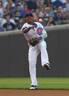 CHICAGO, IL - JUNE 19: Starlin Castro #13 of the Chicago Cubs leaps to make a throw to 2nd base against the New York Yankees at Wrigley Field on June 19, 2011 in Chicago, Illinois. The Yankees defeated Cubs 10-4. (Photo by Jonathan Daniel/Getty Images)