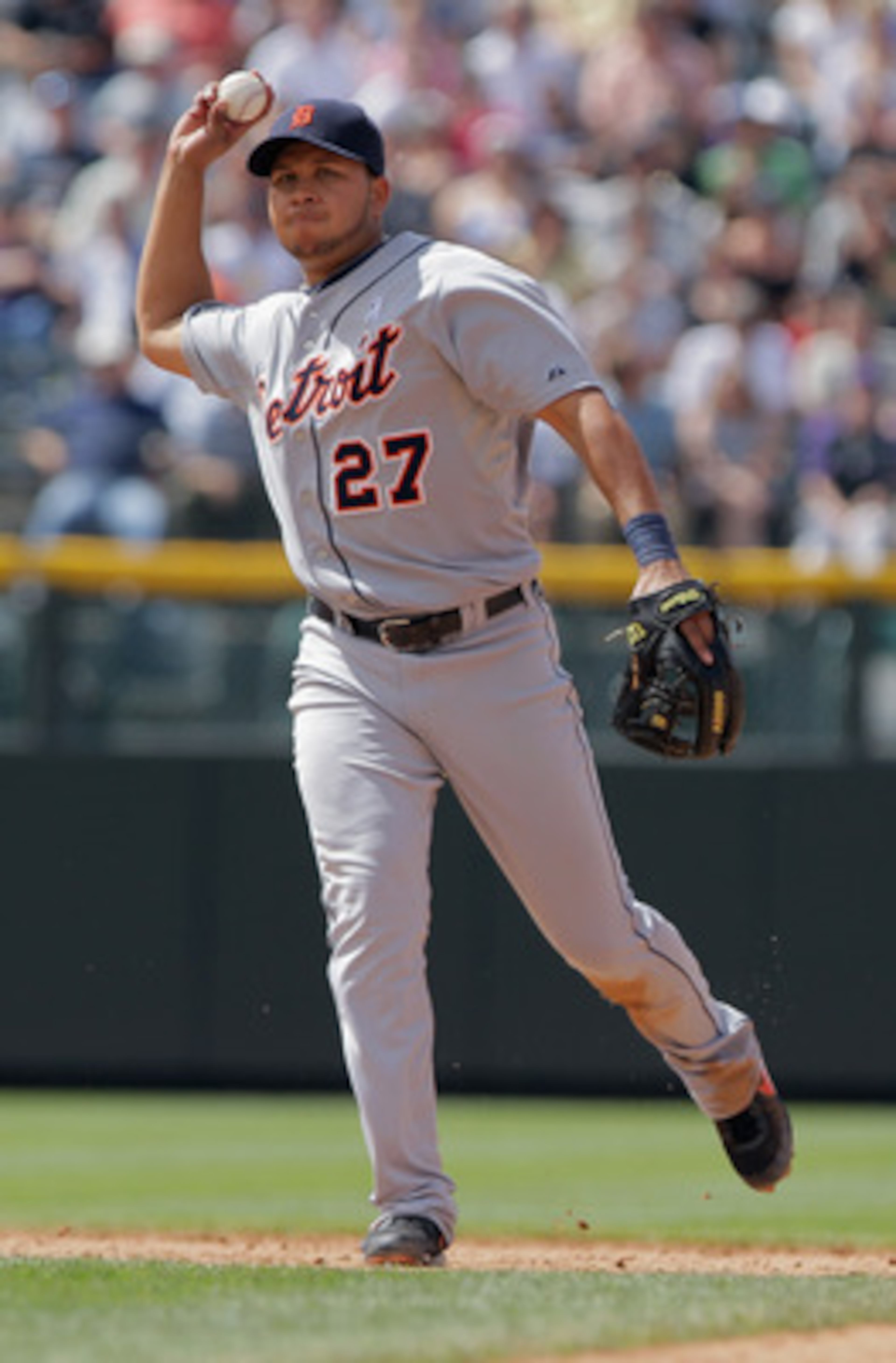 DENVER, CO - JUNE 19:  Shortstop Jhonny Peralta #27 of the Detroit Tigers throws out a runner against the Colorado Rockies at Coors Field on June 19, 2011 in Denver, Colorado. The Tigers defeated the Rockies 9-1.  (Photo by Doug Pensinger/Getty Images)