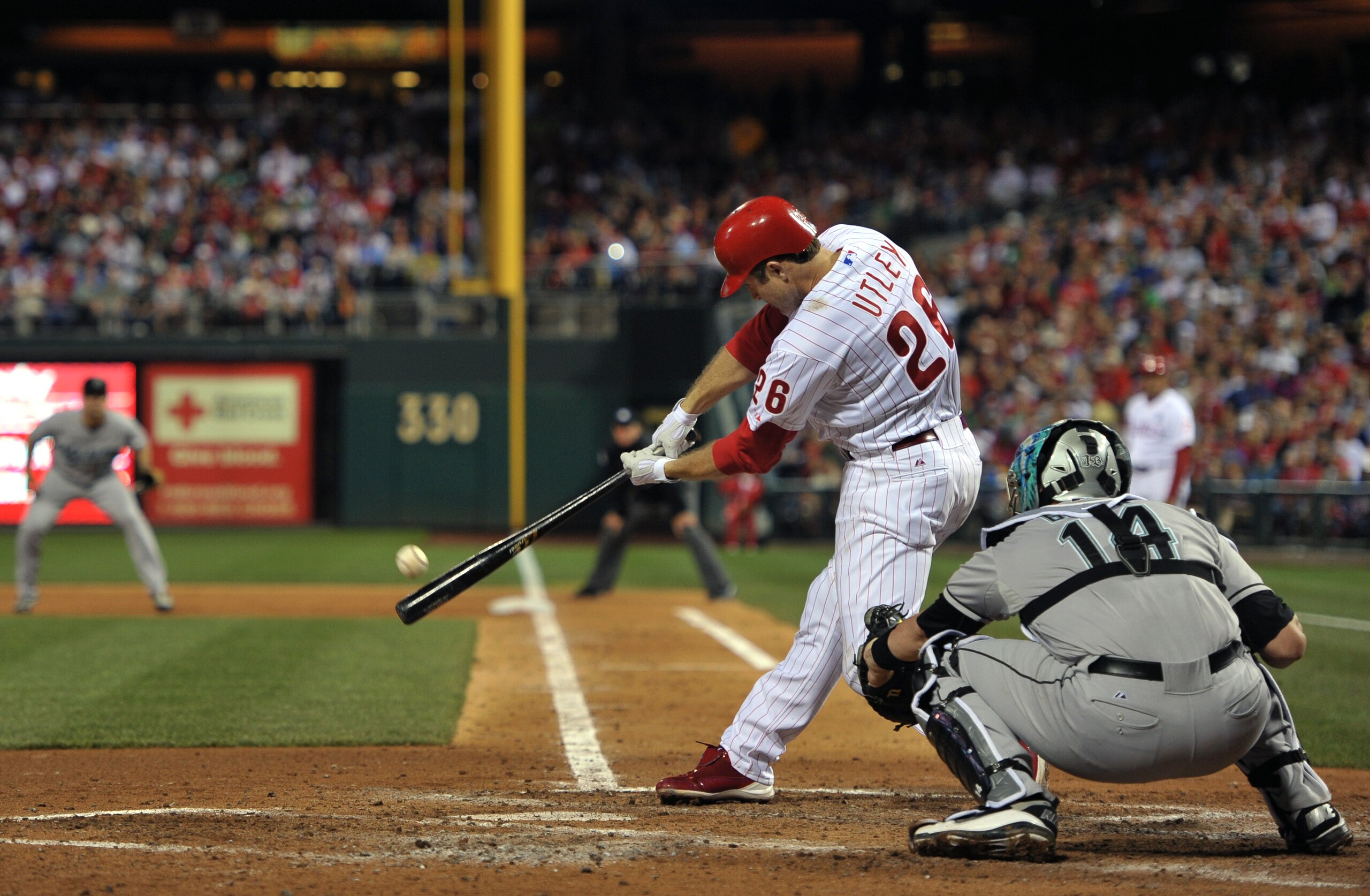 PHILADELPHIA, PA - JUNE 14: Chase Utley #26 of the Philadelphia Phillies hits a double during the game against the Florida Marlins at Citizens Bank Park on June 14, 2011 in Philadelphia, Pennsylvania. (Photo by Drew Hallowell/Getty Images)