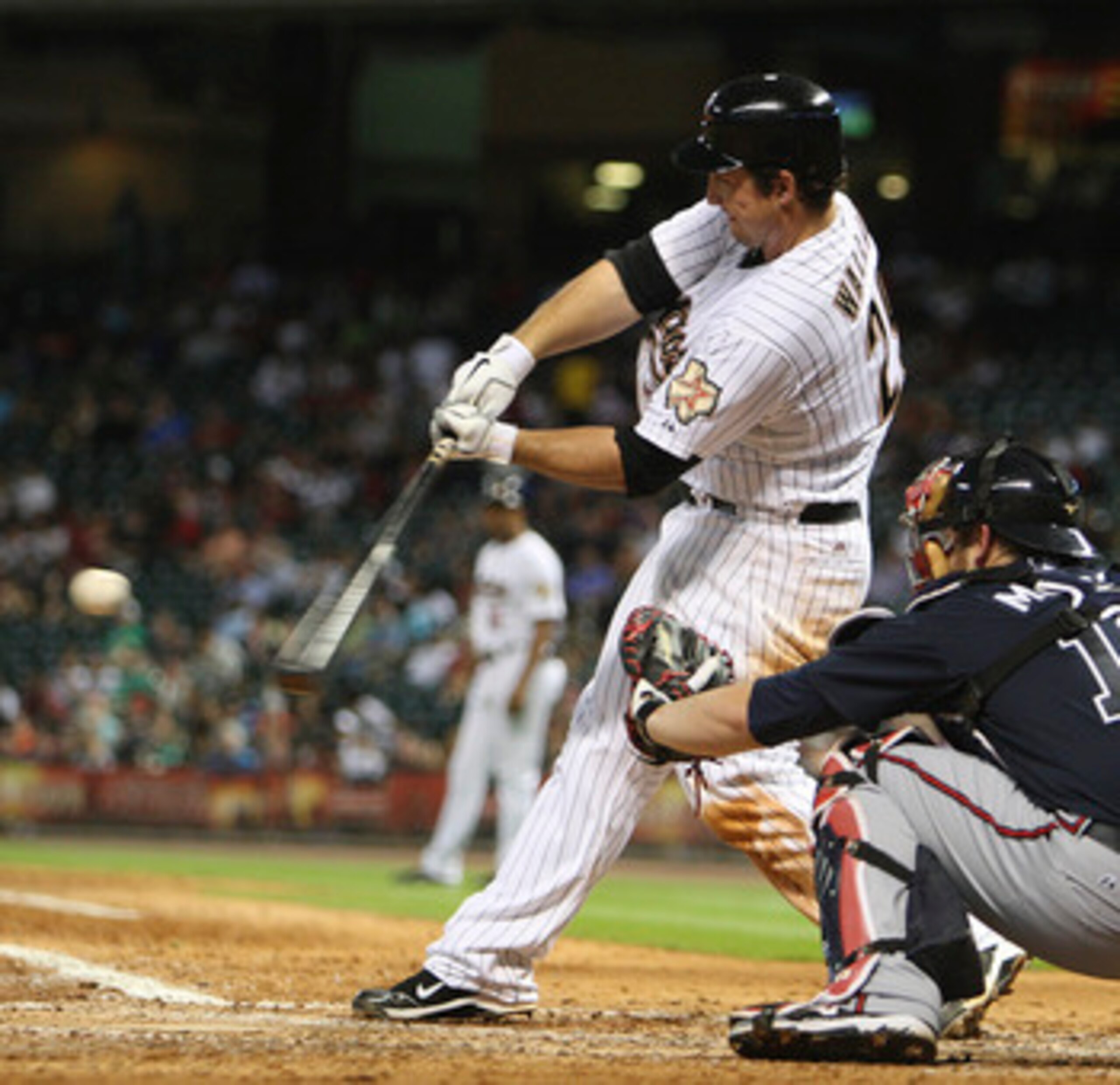 HOUSTON - JUNE 13:  Brett Wallace #29 of the Houston Astros doubles to center field against the Atlanta Braves in the sixth inning at Minute Maid Park on June 13, 2011 in Houston, Texas.  (Photo by Bob Levey/Getty Images)