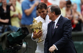 LONDON, ENGLAND - JULY 04:  Rafael Nadal of Spain holds the Championship trophy with Wimbledon CEO Ian Ritchie after winning the Men's Singles Final match against Tomas Berdych of Czech Republic on Day Thirteen of the Wimbledon Lawn Tennis Championships a