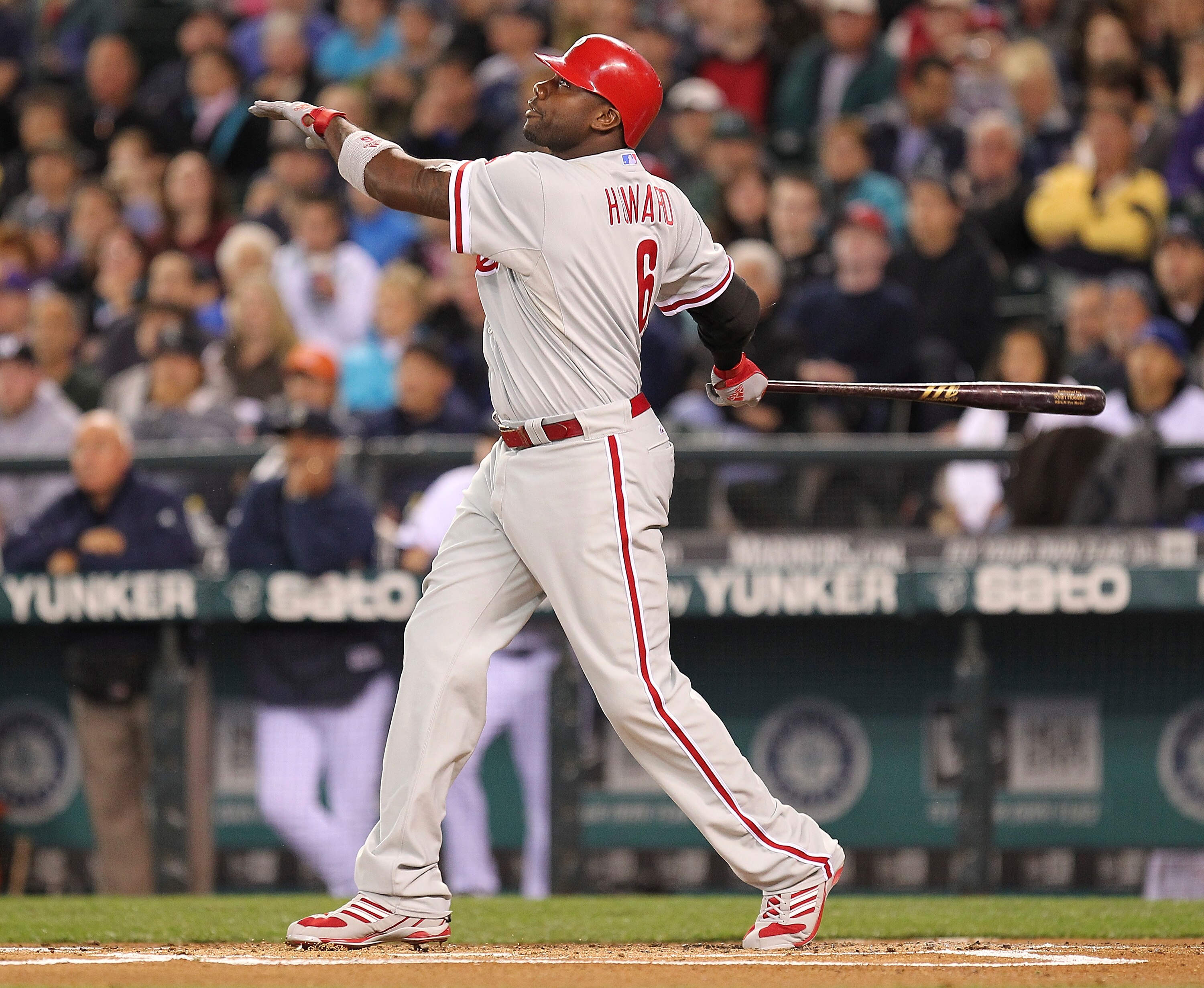 SEATTLE - JUNE 18:  Ryan Howard #6 of the Philadelphia Phillies hits a RBI sacrifice fly in the first inning to take a 1-0 lead against the Seattle Mariners at Safeco Field on June 18, 2011 in Seattle, Washington. (Photo by Otto Greule Jr/Getty Images)
