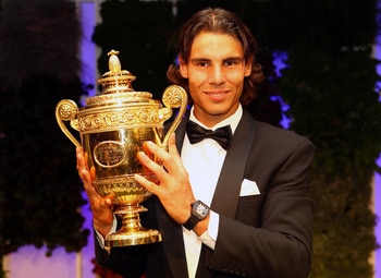 LONDON, ENGLAND - JULY 04:  Rafael Nadal of Spain with the winners trophy at the Wimbledon Championships 2010 Winners Ball at the InterContinental Park Lane Hotel on July 4, 2010 in London, England.  (Photo by Julian Finney/Getty Images)