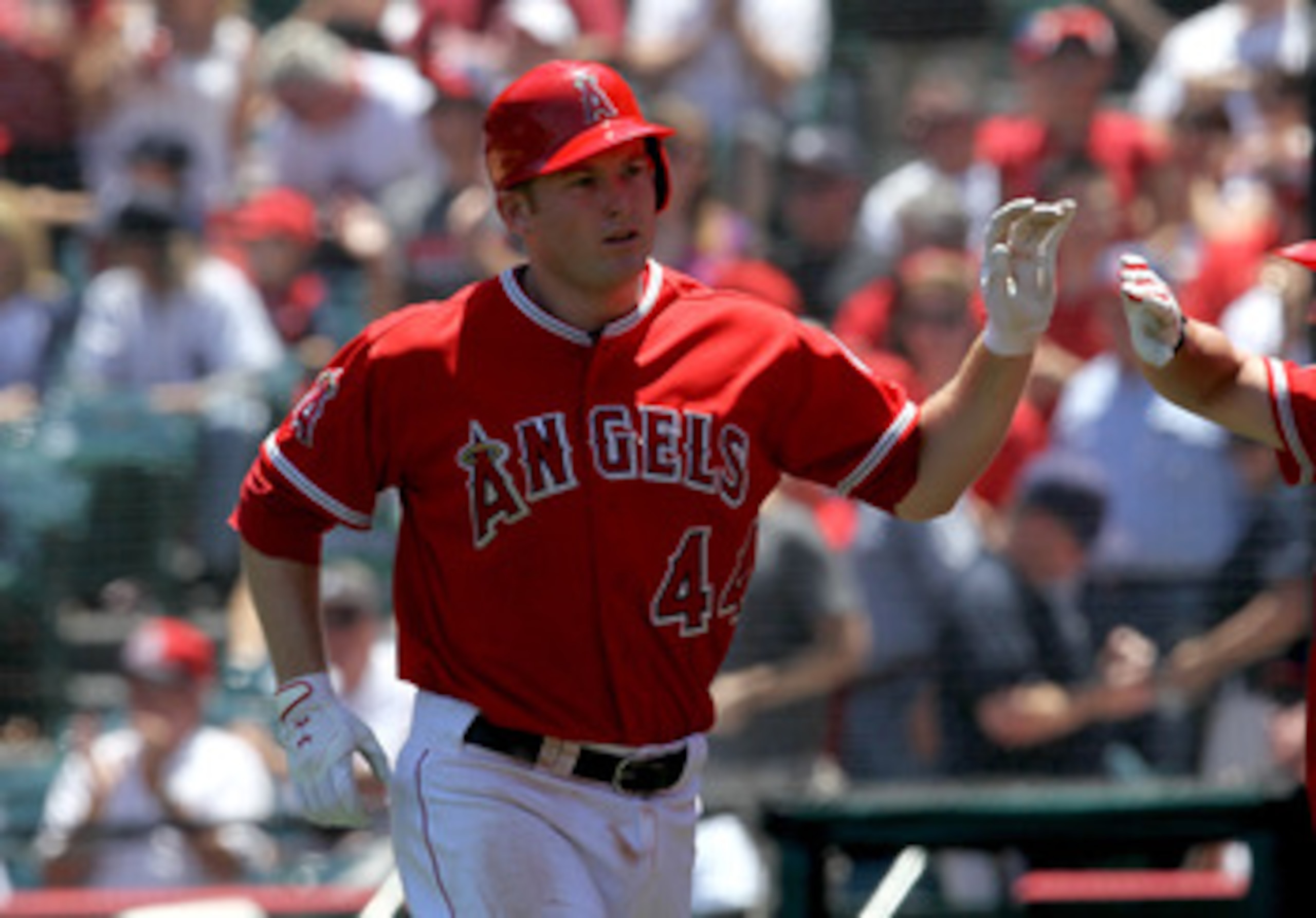 ANAHEIM, CA - JUNE 05:  Mark Trumbo #44 of the Los Angeles Angels of Anaheim is greeted as he returns to the dugout after hitting a home run in the third inning against the New York Yankees on June 5, 2011 at Angel Stadium in Anaheim, California. The Yank