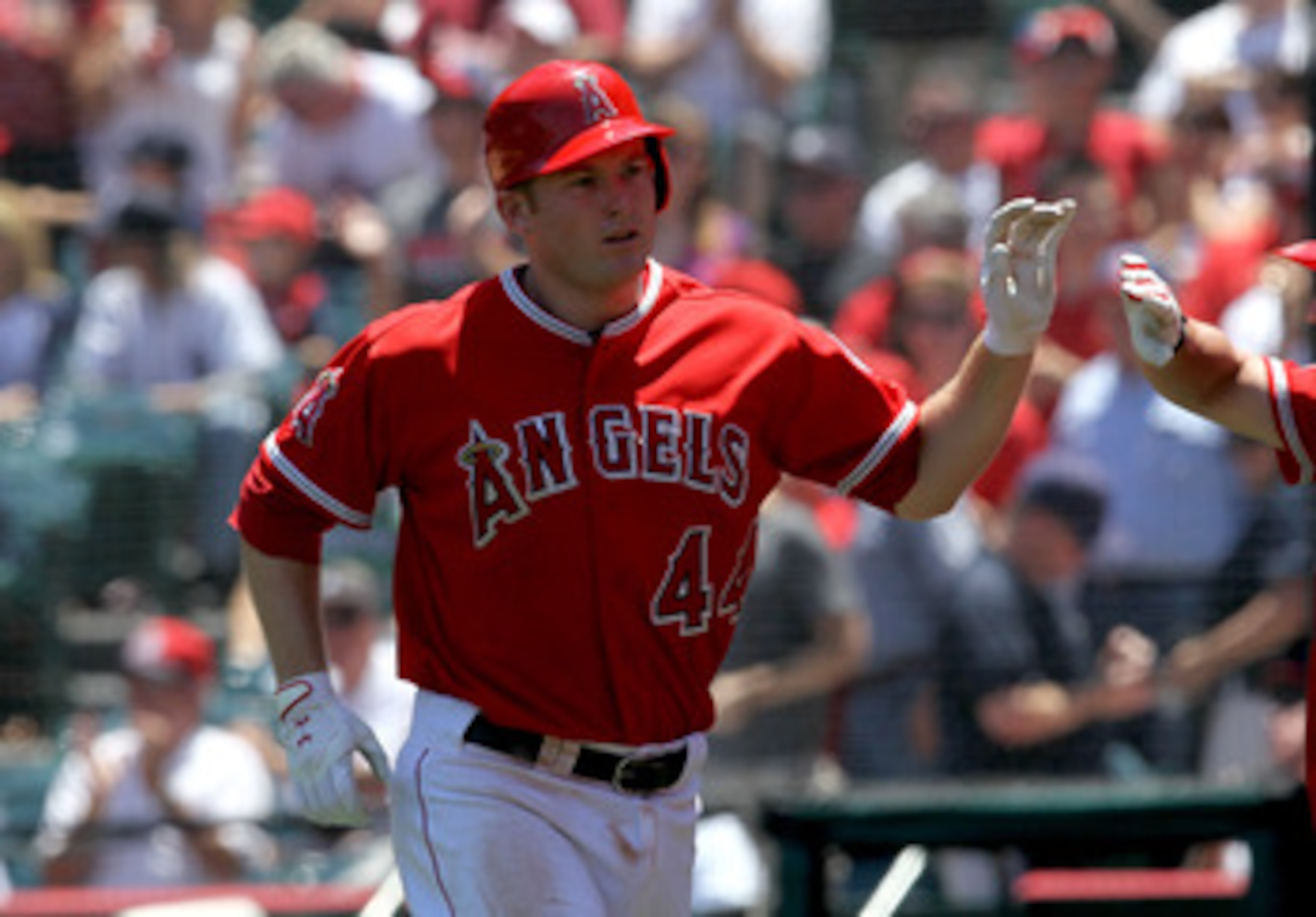 ANAHEIM, CA - JUNE 05:  Mark Trumbo #44 of the Los Angeles Angels of Anaheim is greeted as he returns to the dugout after hitting a home run in the third inning against the New York Yankees on June 5, 2011 at Angel Stadium in Anaheim, California. The Yank